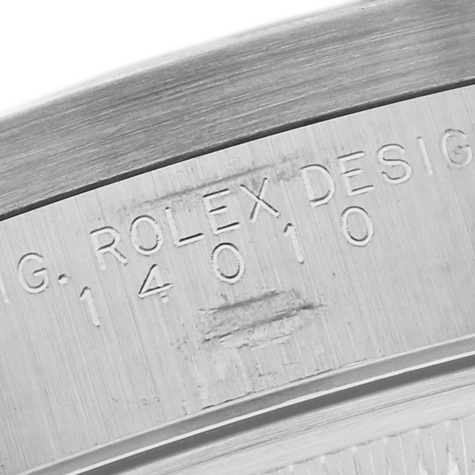This image shows a close-up of the engraved model number on the case back of a Rolex Air-King 14010 Men's Stainless Steel Silver Dial 14010 Men's Stainless Steel Silver Dial watch.