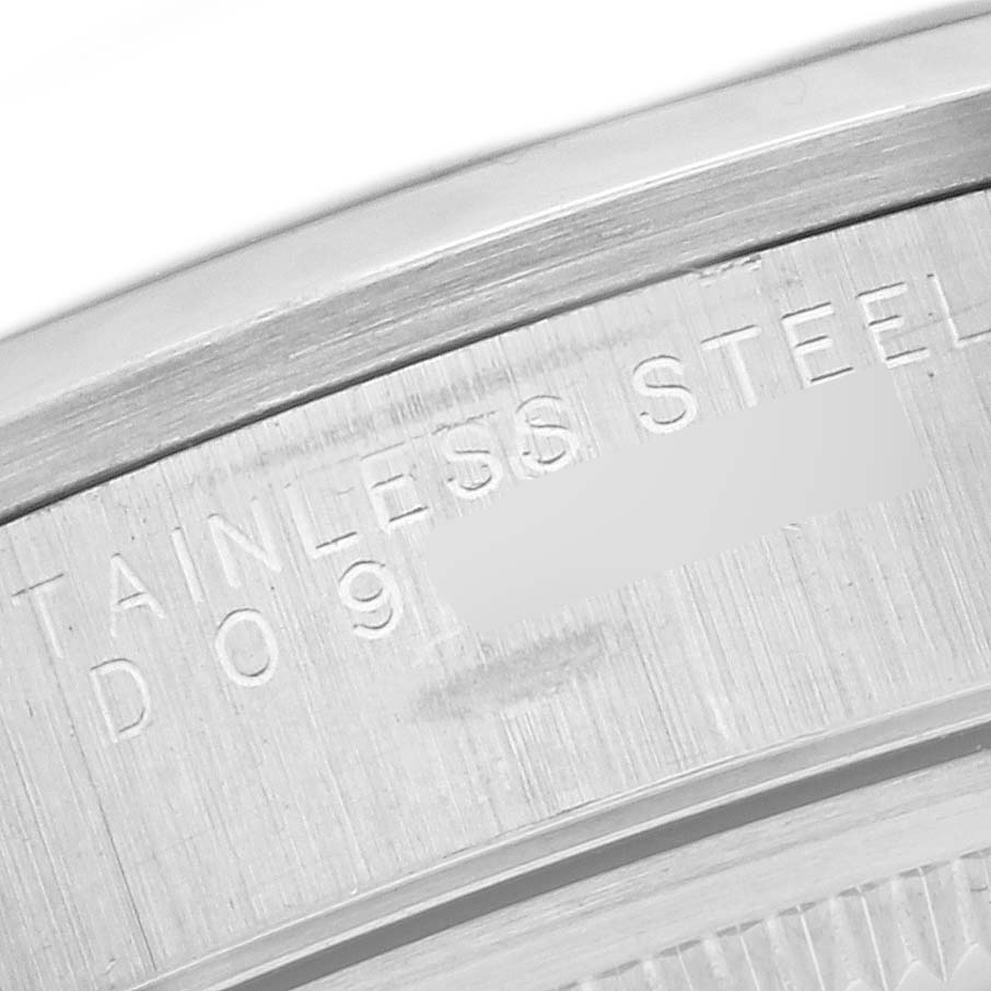 This image shows a close-up view of the back casing of the Rolex Air-King 14000 Men's Stainless Steel Silver Dial 14000 Men's Stainless Steel Silver Dial watch, revealing part of the "STAINLESS STEEL" engraving.
