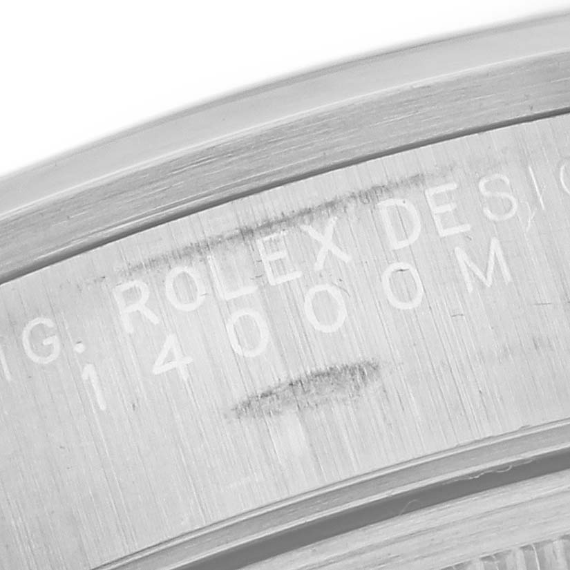 The image shows a close-up of the engraving on the case back of a Rolex Air-King 14000 Men's Stainless Steel Silver Dial 14000 Men's Stainless Steel Silver Dial watch.