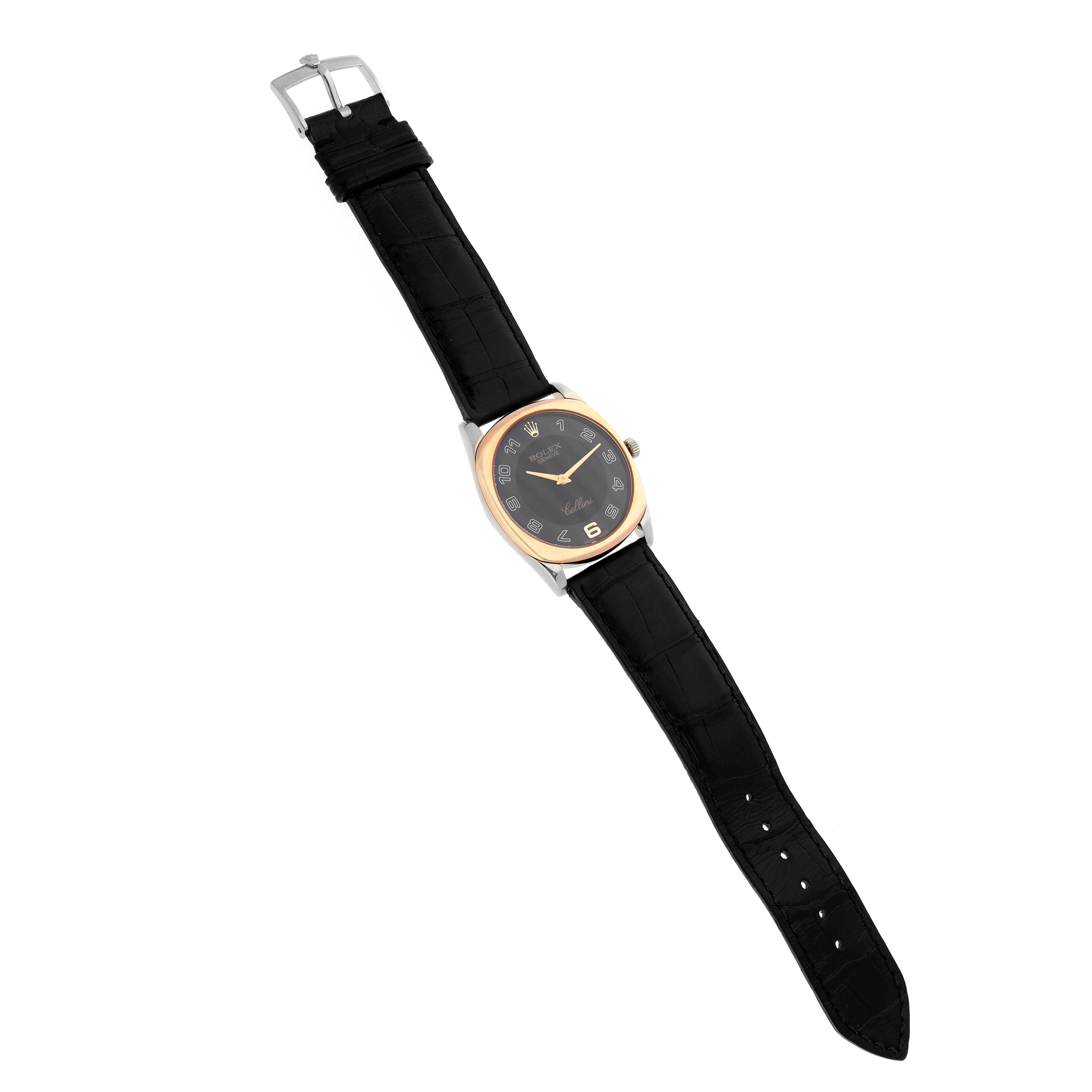 The Rolex Cellini 4233 Men
s White Gold Black Dial 4233 Men
s White Gold Black Dial watch is shown from a top-down angle, displaying its entire face, strap, and buckle.