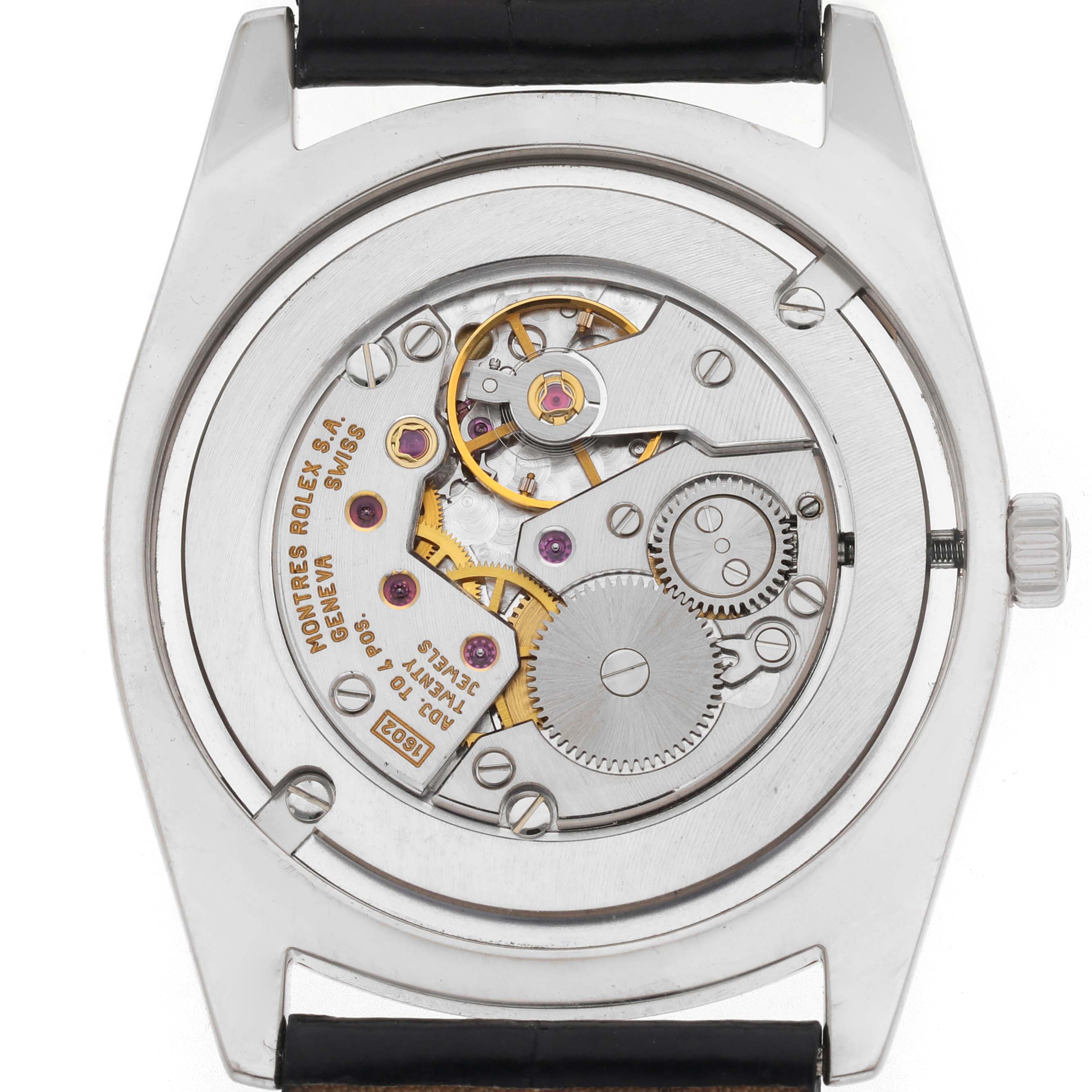 The image shows the back view of a Rolex Cellini 4233 Men
s White Gold Black Dial 4233 Men
s White Gold Black Dial watch, revealing its intricate mechanical movement.