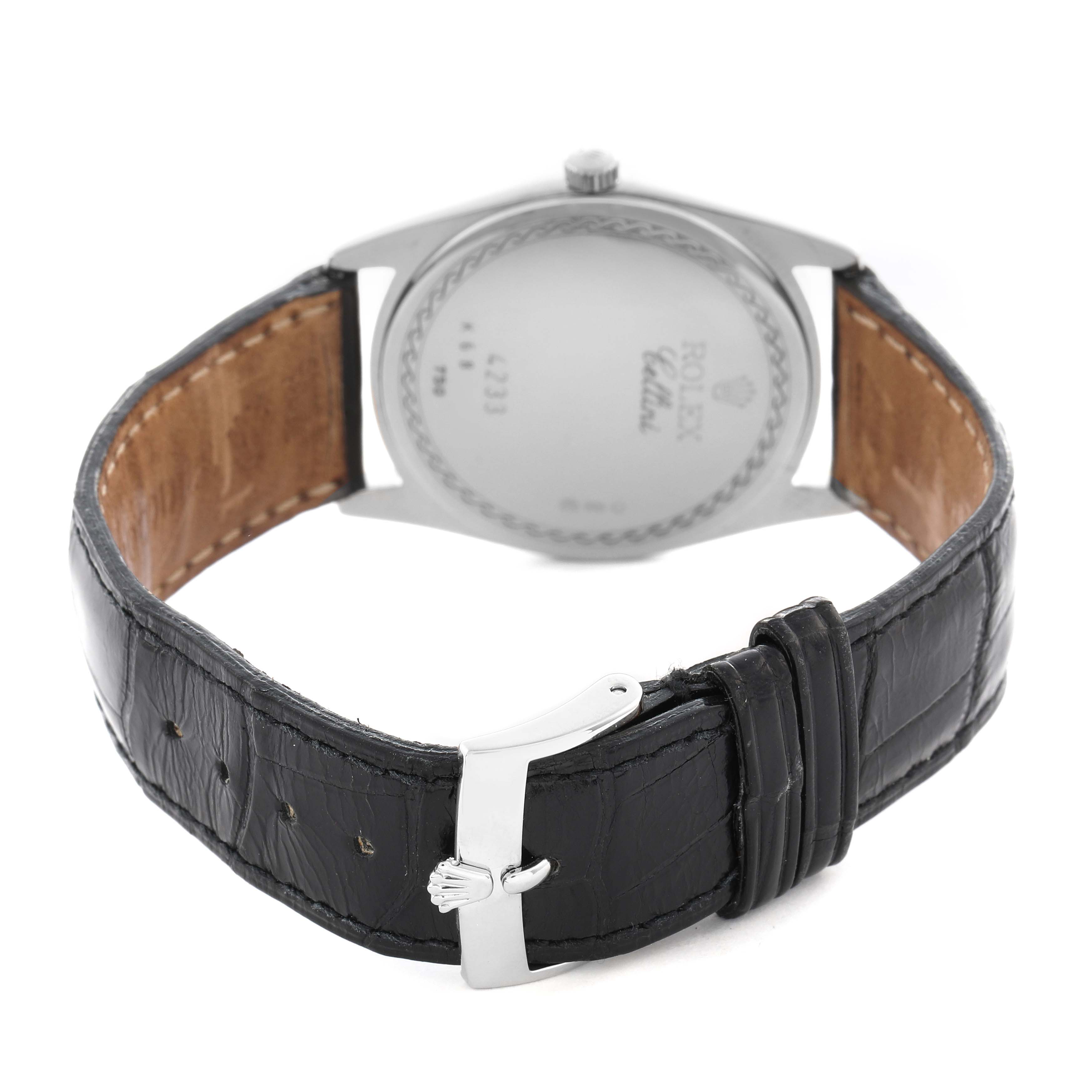 The image shows the back view of a Rolex Cellini 4233 Men
s White Gold Black Dial 4233 Men
s White Gold Black Dial watch, highlighting the case back, leather strap, and buckle.