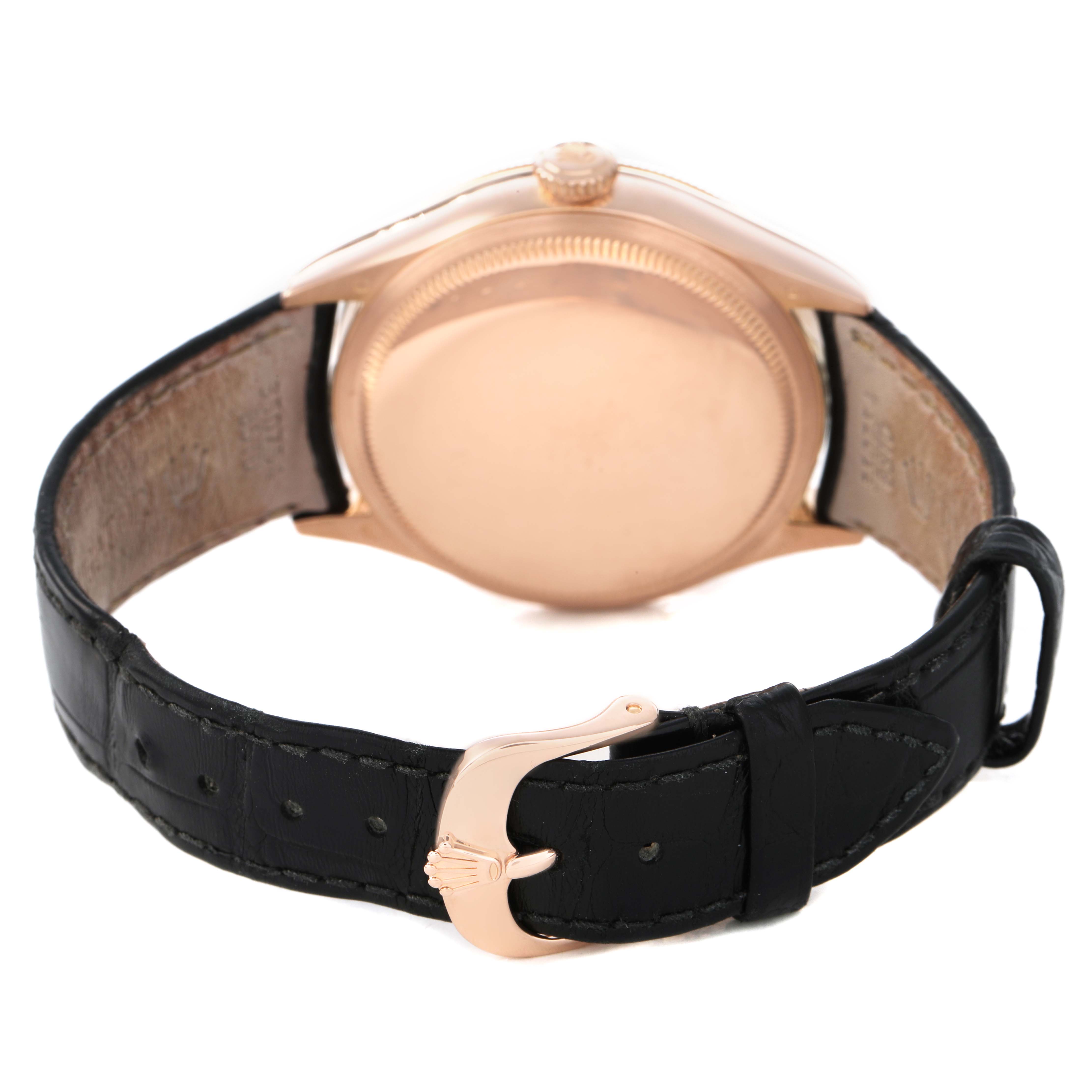 The Rolex Cellini 50525 Men's Rose Gold Silver Dial watch is shown from the back, highlighting the case back and leather strap with a view of the clasp.