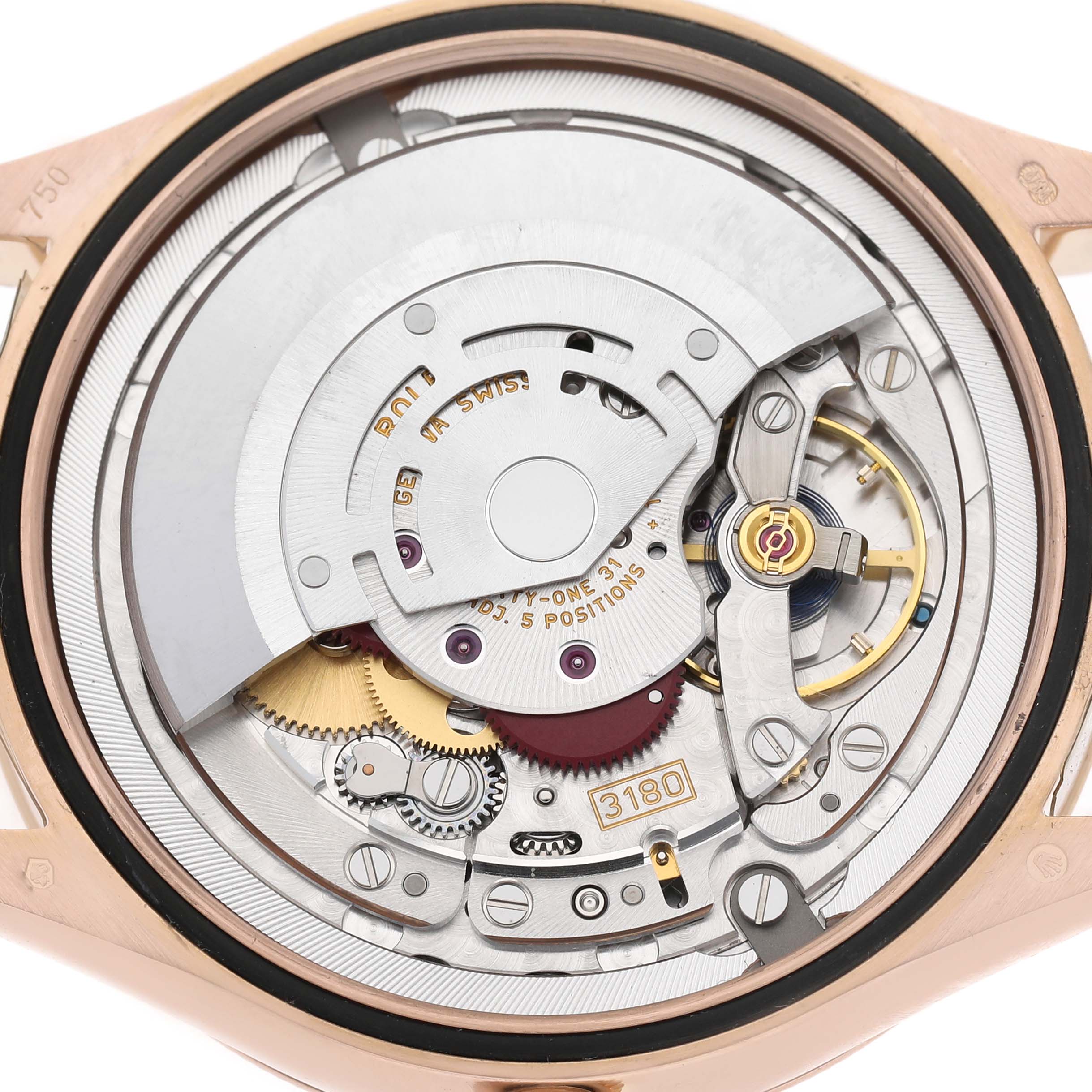 The image shows the movement mechanism of a Rolex Cellini 50525 Men's Rose Gold Silver Dial watch from a back angle, highlighting gears and components.