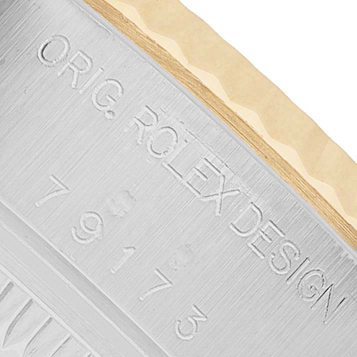 The image shows a close-up of the engraving on the Rolex Datejust 79173 Women's Stainless Steel White Dial case side, highlighting "ORIG. ROLEX DESIGN."