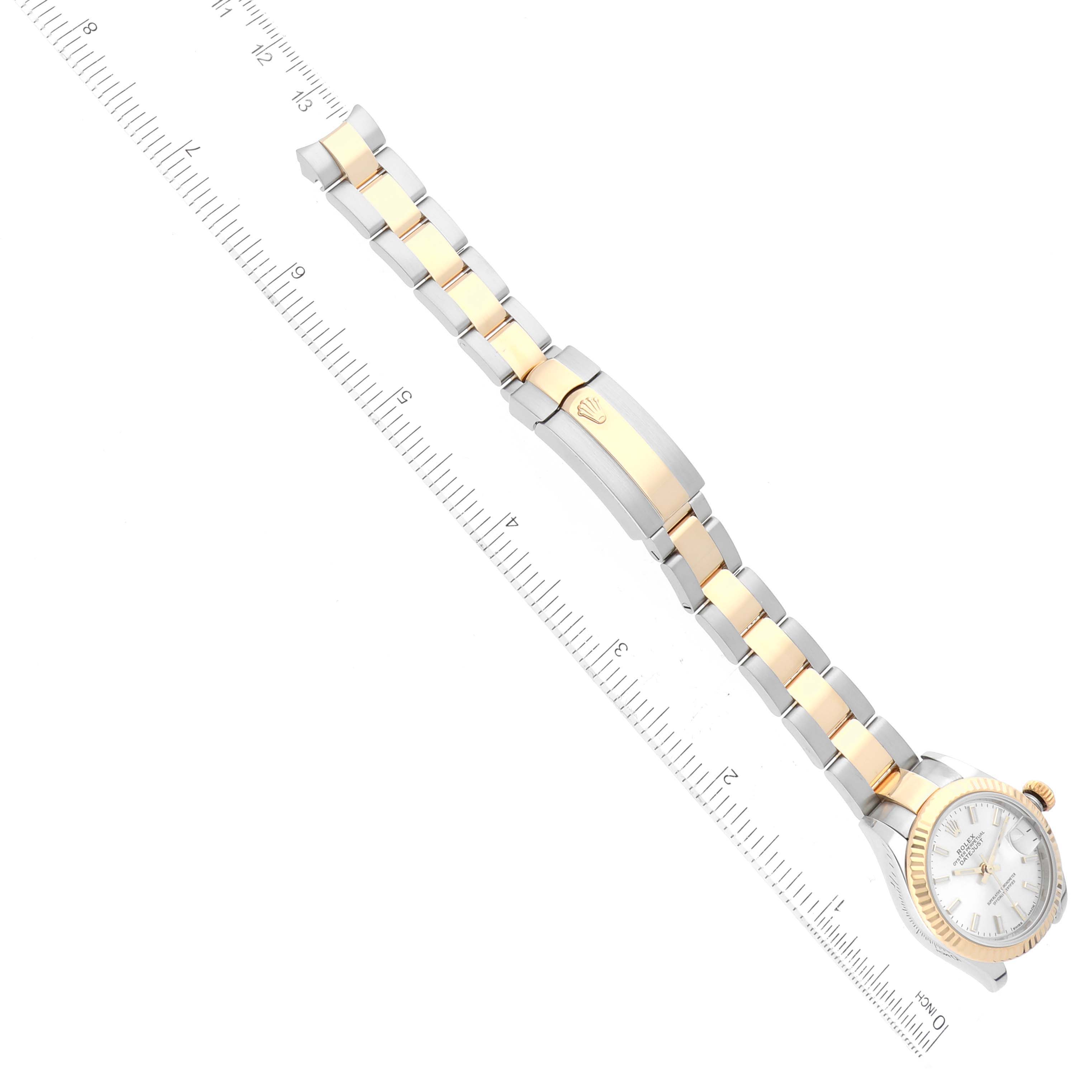 The image shows a top-down view of a Rolex Datejust 279173 Women's Steel and Gold (two tone) Silver Dial 279173 Women's Steel and Gold (two tone) Silver Dial watch laid next to a measuring ruler.