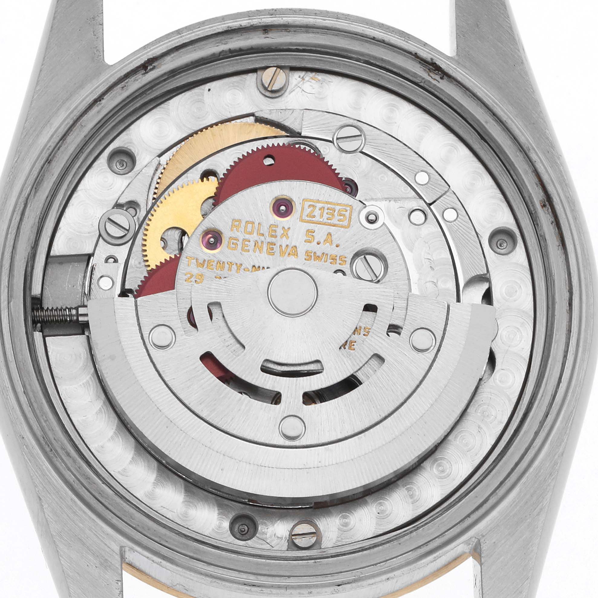 The image shows the back view of a Rolex Mid-Size 68273 Women
s Steel and Gold (two tone) Champagne Dial 68273 Women
s Steel and Gold (two tone) Champagne Dial watch, revealing its internal movement components.