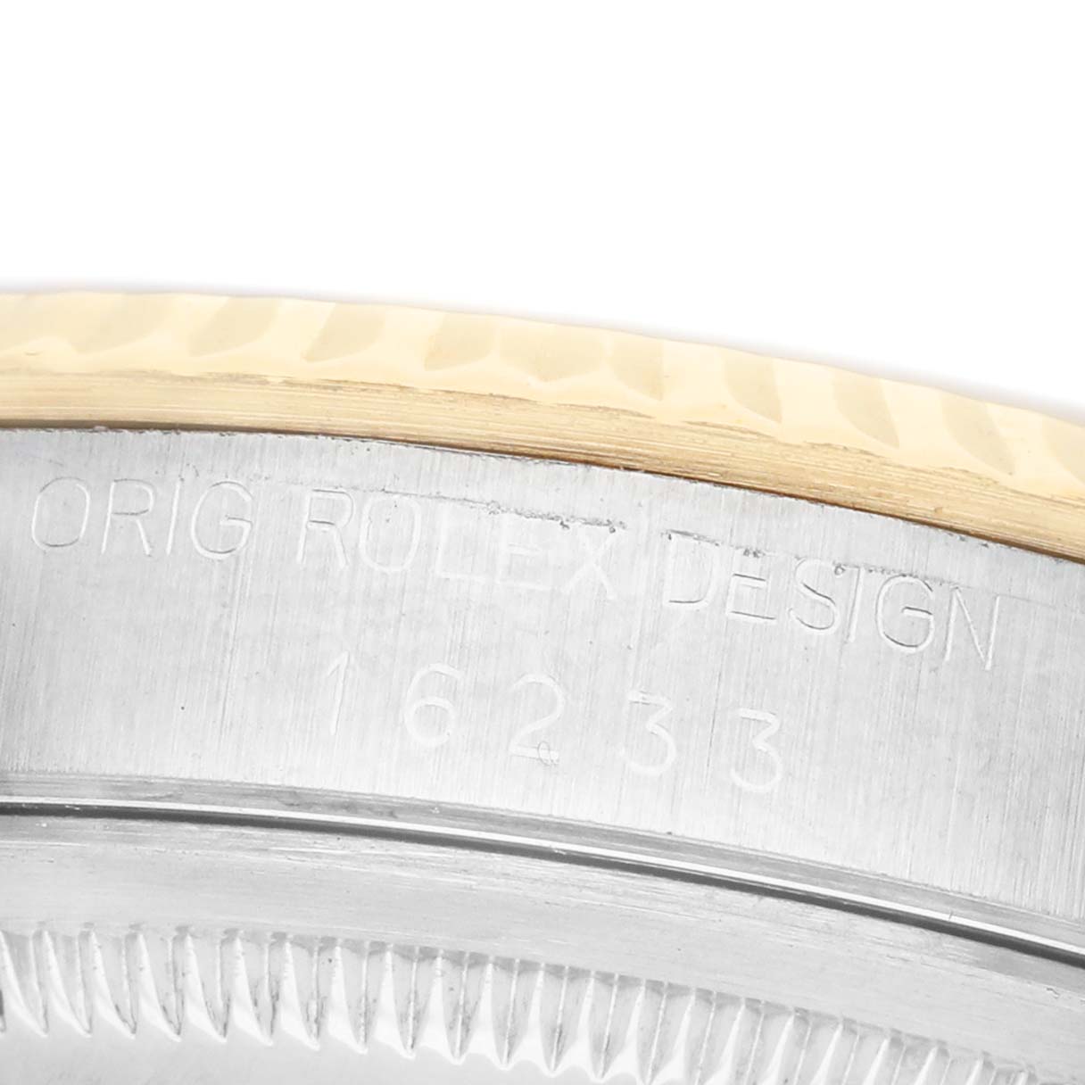 The image shows a close-up of the Datejust model by Rolex, highlighting the model number engraving on the case side.