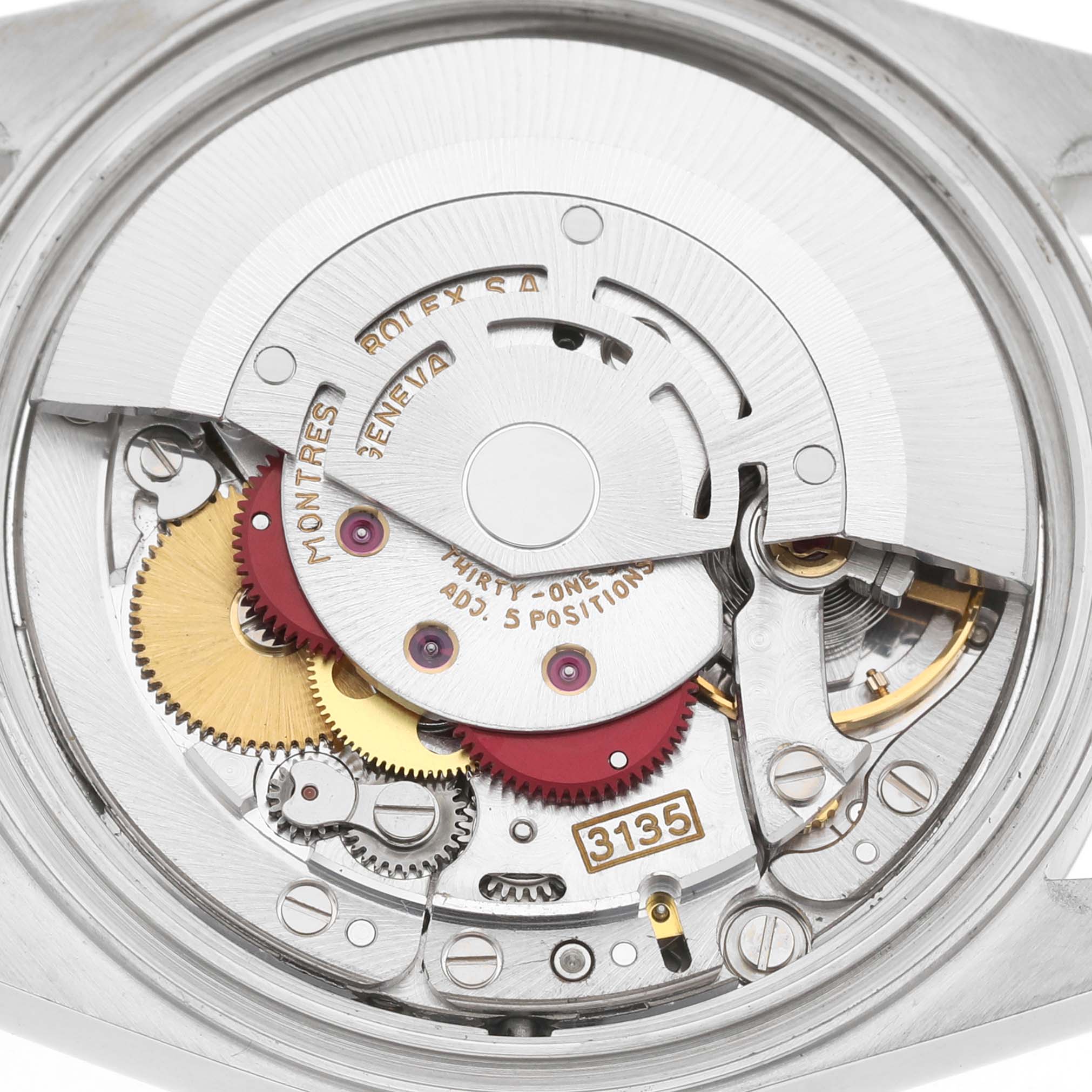 The image shows the movement of a Rolex Datejust 16233 Men's Stainless Steel Silver Dial watch from a top-down angle, highlighting gears and the rotor.