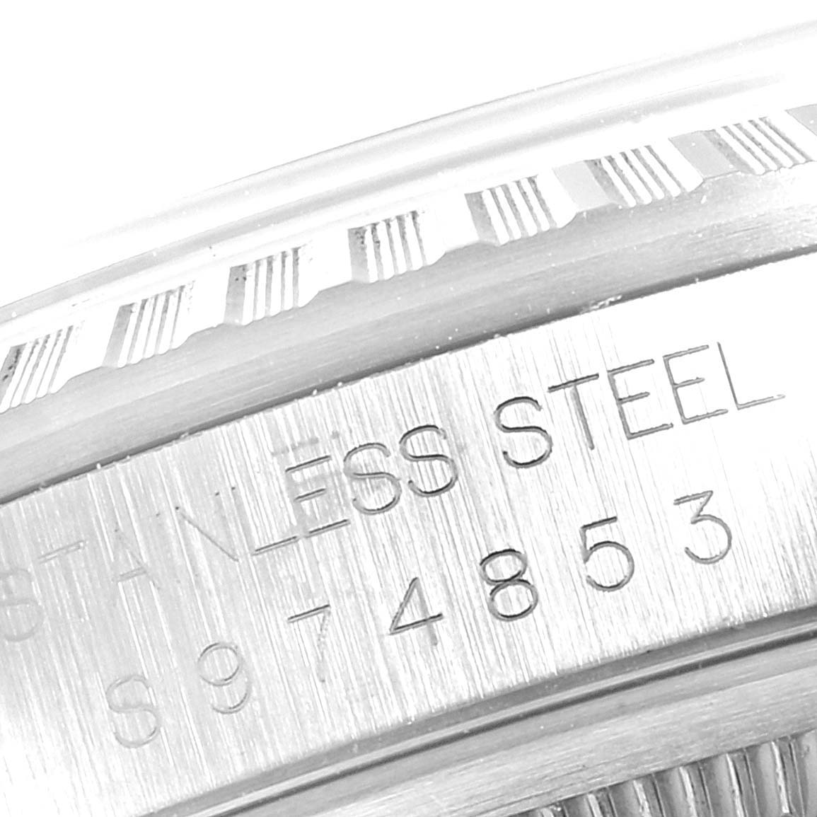 The image showcases a close-up view of the stainless steel case and engraved serial number on a Rolex Datejust 16220 Men's Stainless Steel White Dial 16220 Men's Stainless Steel White Dial watch.