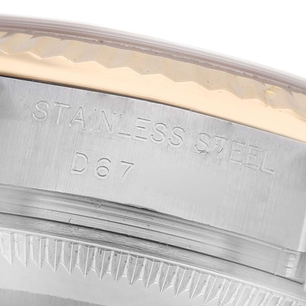 The image shows a close-up of the stainless steel side and bezel of a Rolex Datejust 179173 Women's Steel and Gold (two tone) Champagne Dial 179173 Women's Steel and Gold (two tone) Champagne Dial watch with focus on the engravings.