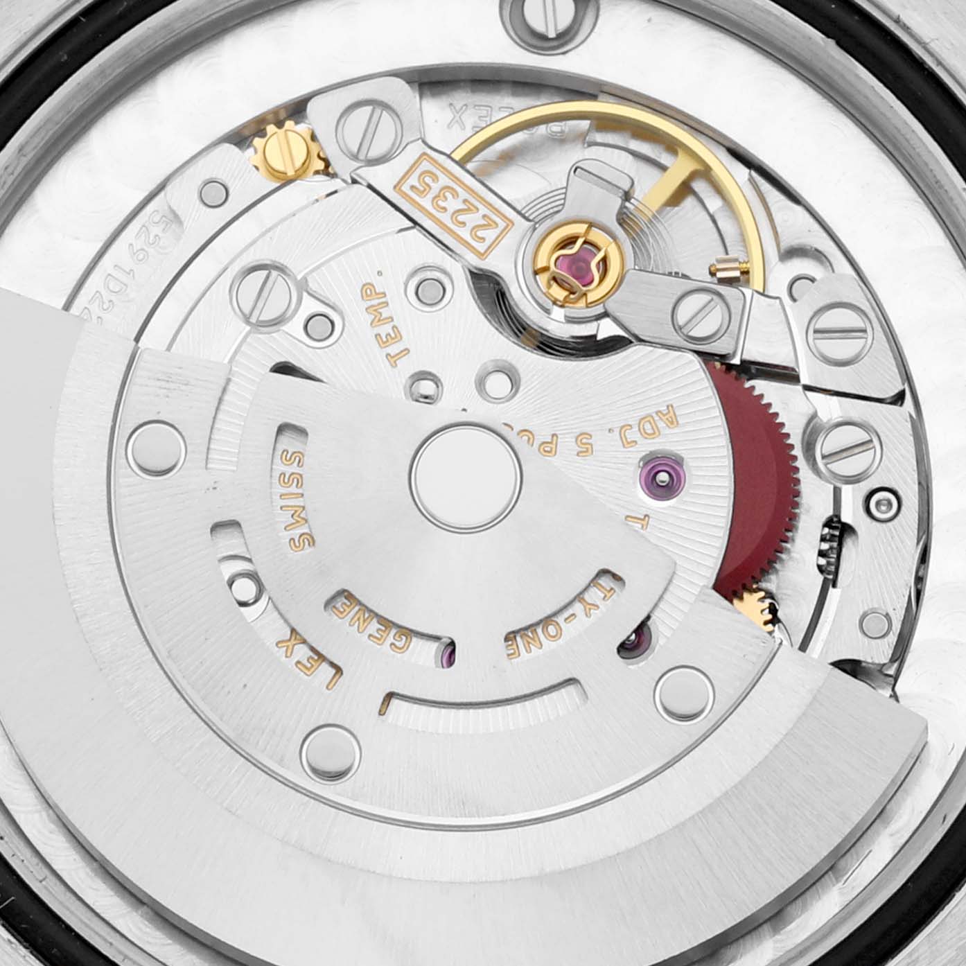 This close-up image of a Rolex Mid-Size 178274 Women
s Stainless Steel Silver Dial 178274 Women
s Stainless Steel Silver Dial model watch shows its intricate internal movement mechanism from a rear angle.