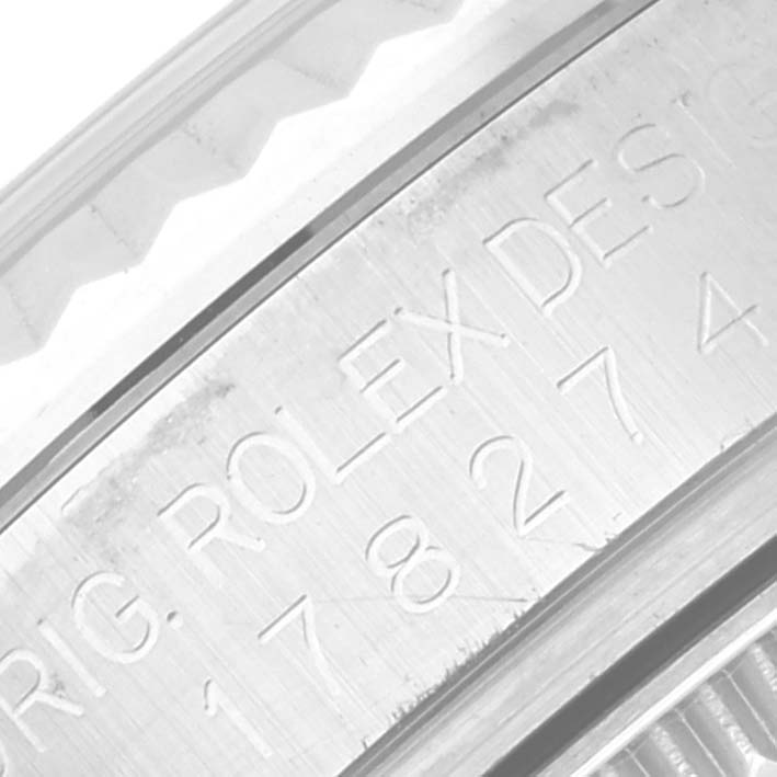 The image shows an engraved side view of the bezel and case back of a Mid-Size Rolex watch.