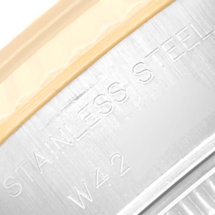 This image shows an angled close-up of the rim inscription on a Rolex Datejust 69173 Women's Steel and Gold (two tone) White Dial 69173 Women's Steel and Gold (two tone) White Dial, highlighting "STAINLESS STEEL."