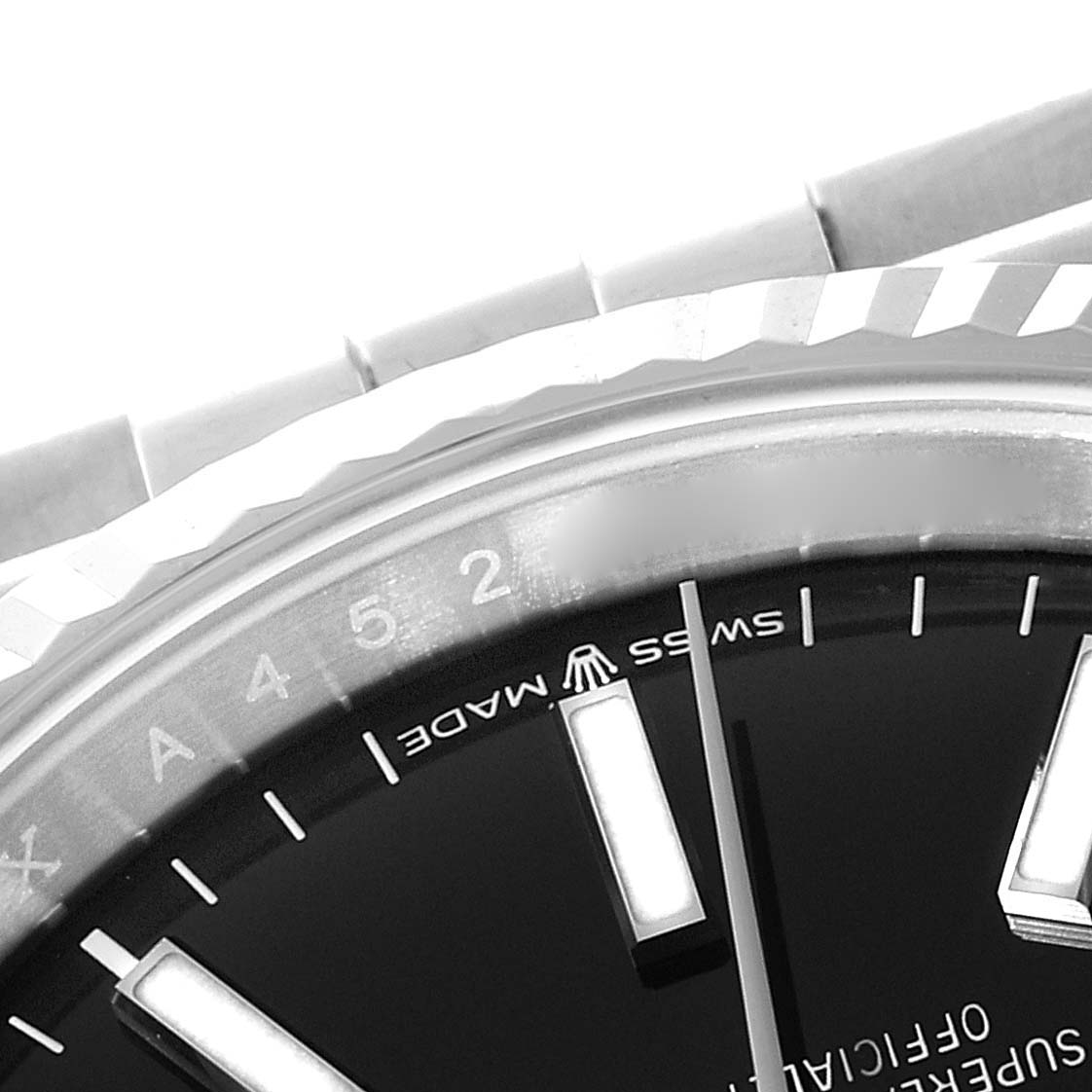 The image shows a close-up of the dial, bezel, and part of the bracelet of a Rolex Datejust M126234-0015 Men's Stainless Steel Black Dial M126234-0015 Men's Stainless Steel Black Dial watch at an angled view.