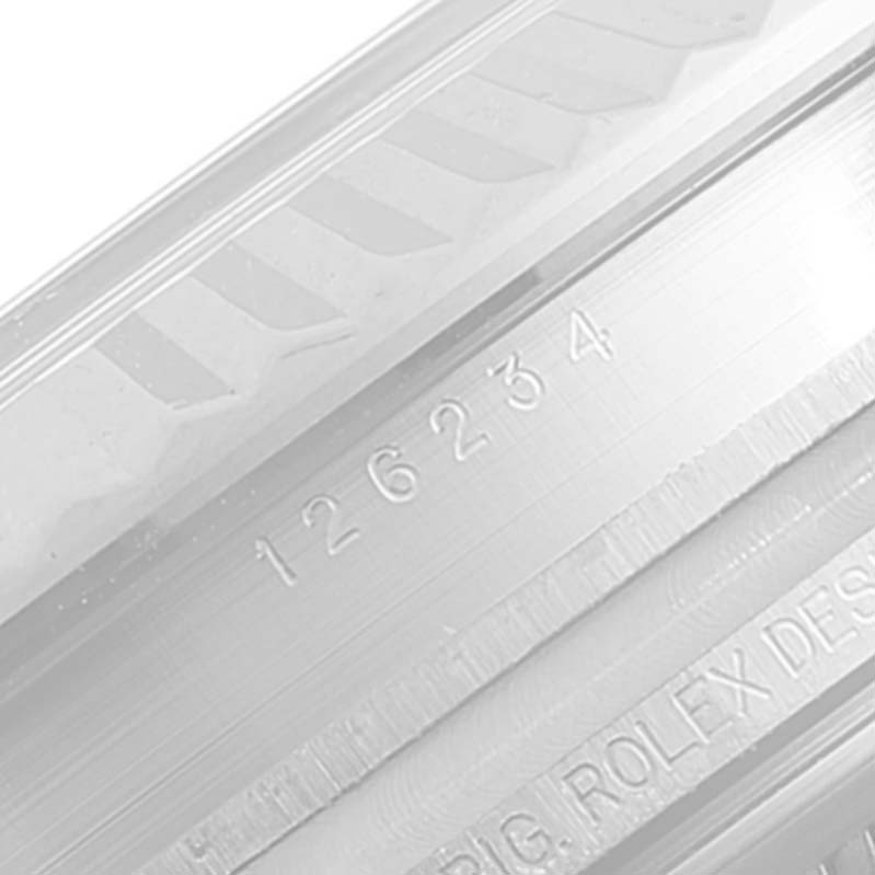This image shows a close-up of the serial and reference numbers on a Rolex Datejust 126234 Men's Stainless Steel Blue Dial 126234 Men's Stainless Steel Blue Dial watch.