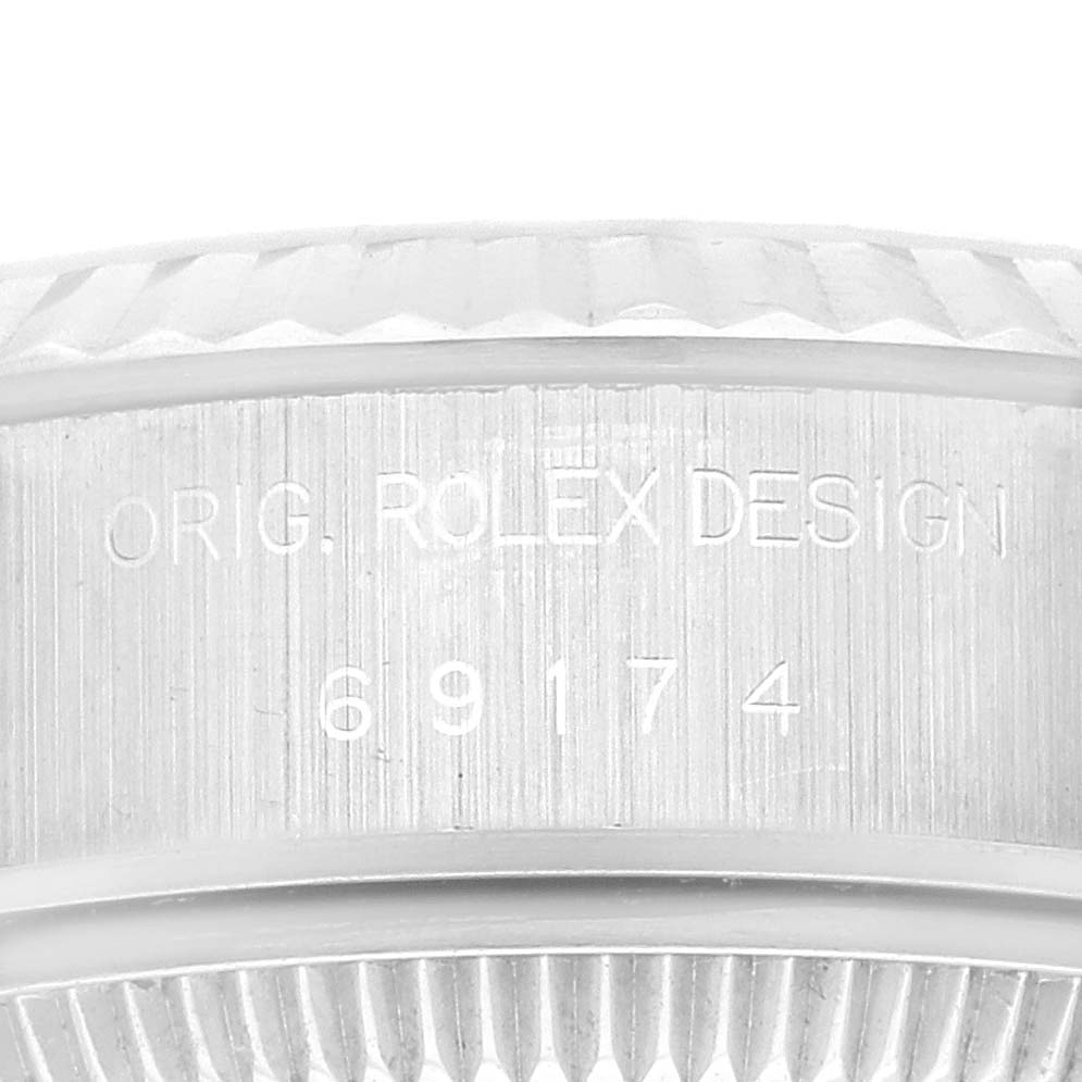 This image shows the side engraving of a Rolex Datejust 69174 Women's Stainless Steel Silver Dial 69174 Women's Stainless Steel Silver Dial watch, showcasing the "ORIG. ROLEX DESIGN" text and model number 69174.