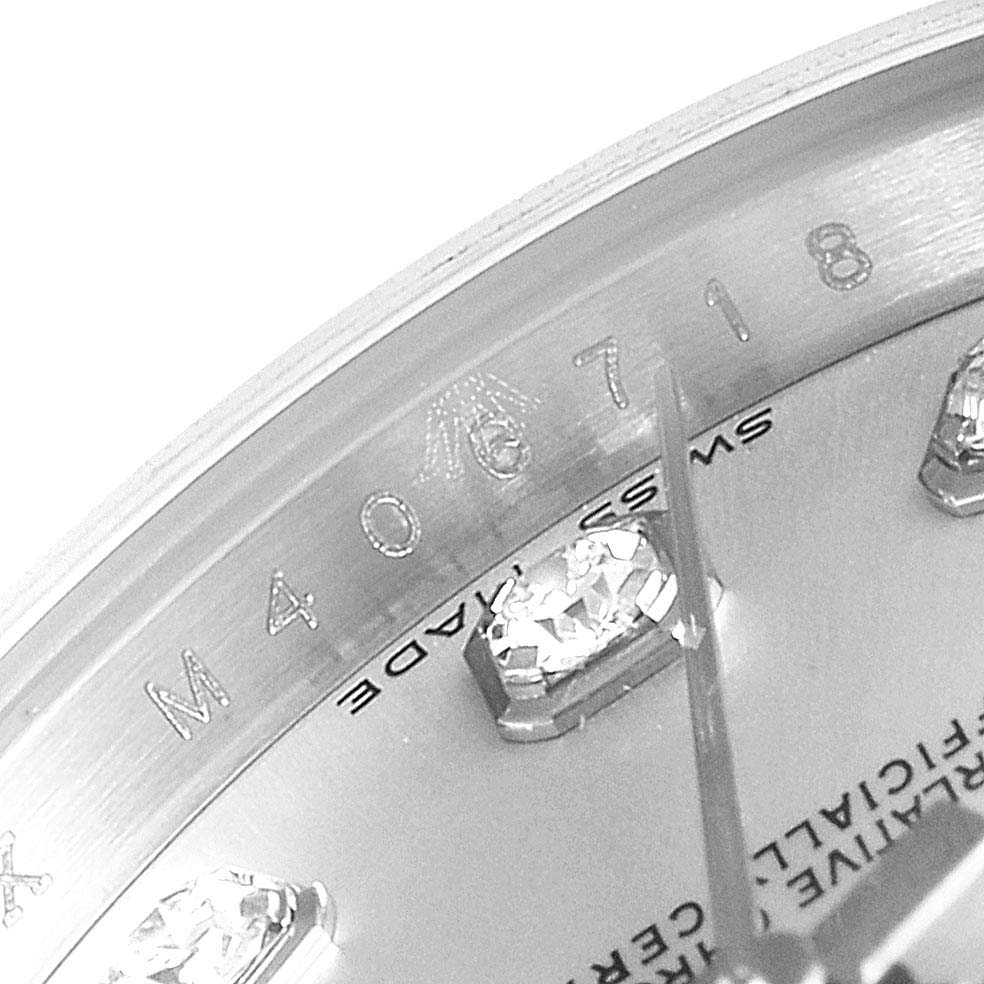 This image shows a close-up, angled view of the dial and etched serial number on a Rolex Datejust 179174 Women's Stainless Steel Silver Dial 179174 Women's Stainless Steel Silver Dial watch.