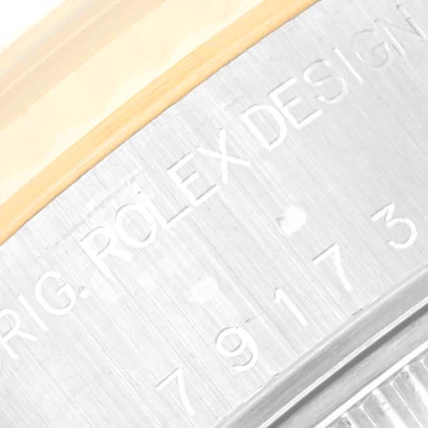 The image shows a close-up of the case back of a Rolex Datejust 79173 Women's Steel and Gold (two tone) Black Dial 79173 Women's Steel and Gold (two tone) Black Dial watch, highlighting the engraved text.