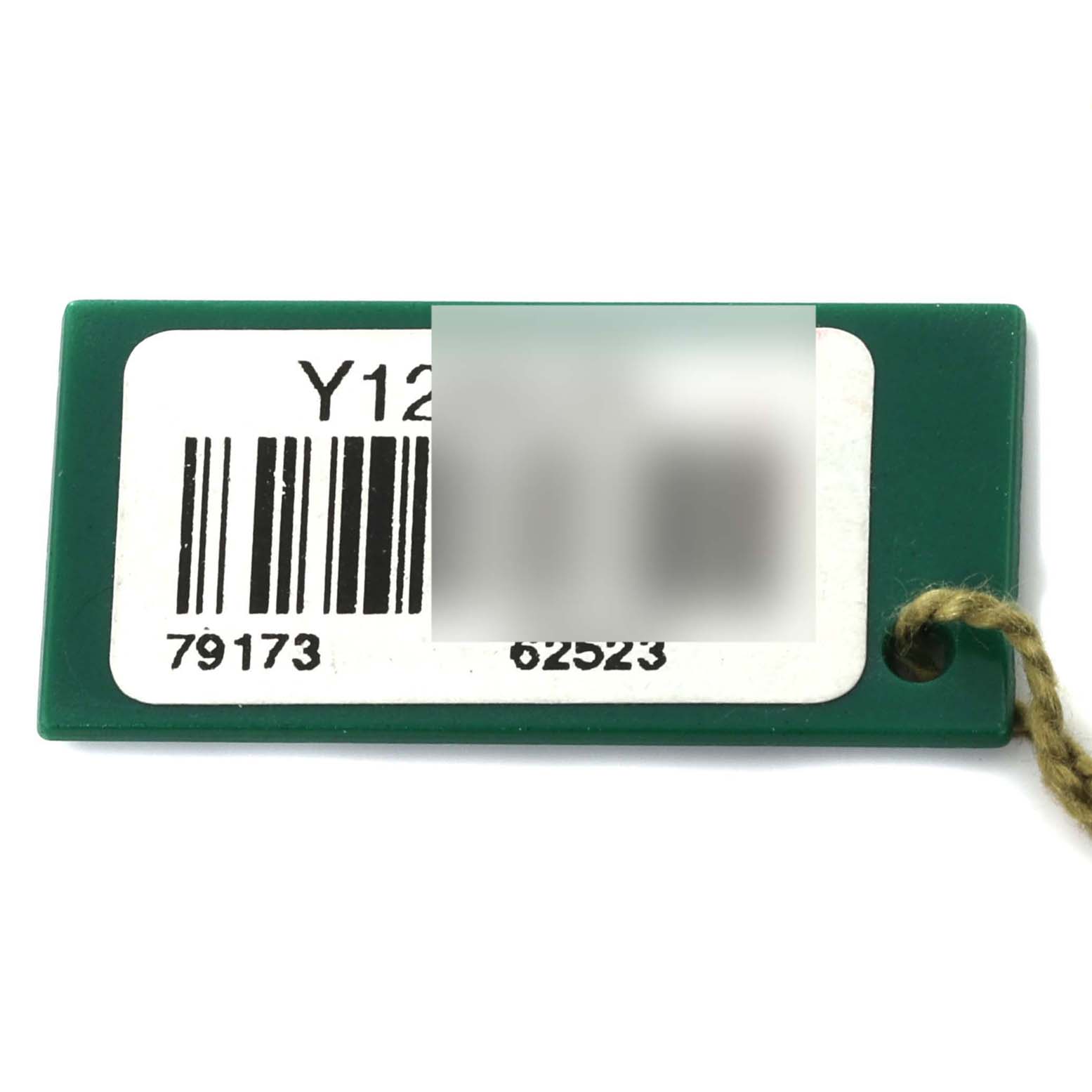 This image shows a close-up of a green tag with barcodes for the Rolex Datejust 79173 Women's Steel and Gold (two tone) Black Dial 79173 Women's Steel and Gold (two tone) Black Dial model.