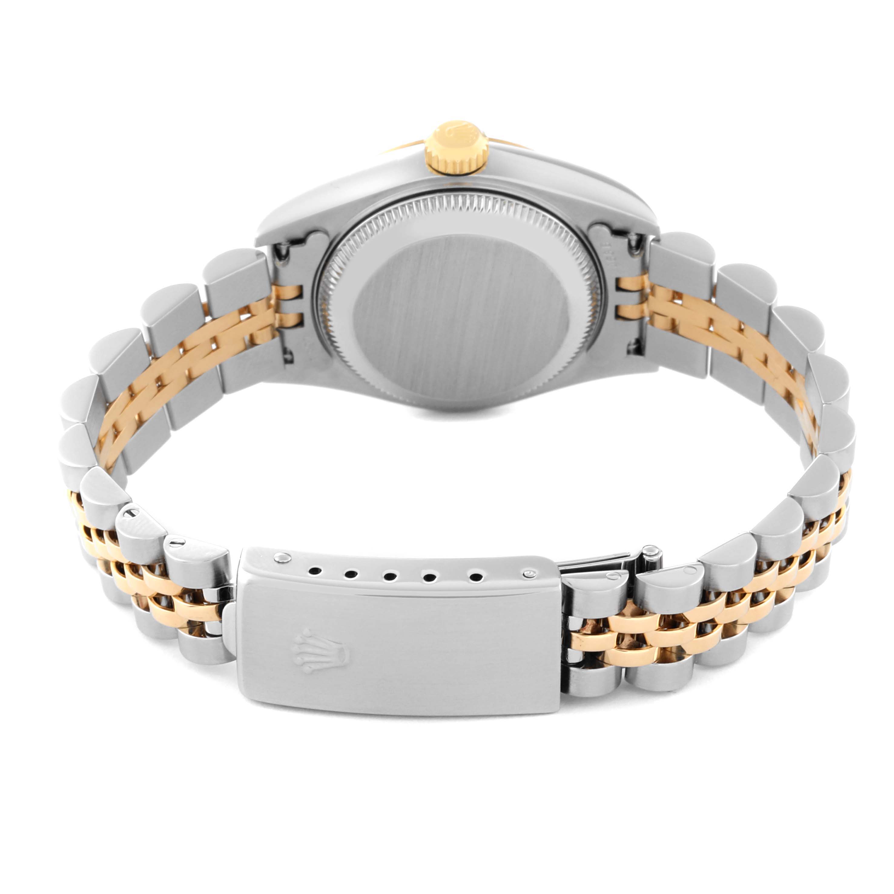 This Rolex Datejust 79173 Women's Steel and Gold (two tone) Black Dial 79173 Women's Steel and Gold (two tone) Black Dial watch is viewed from the back, showcasing the case, crown, and two-tone bracelet.