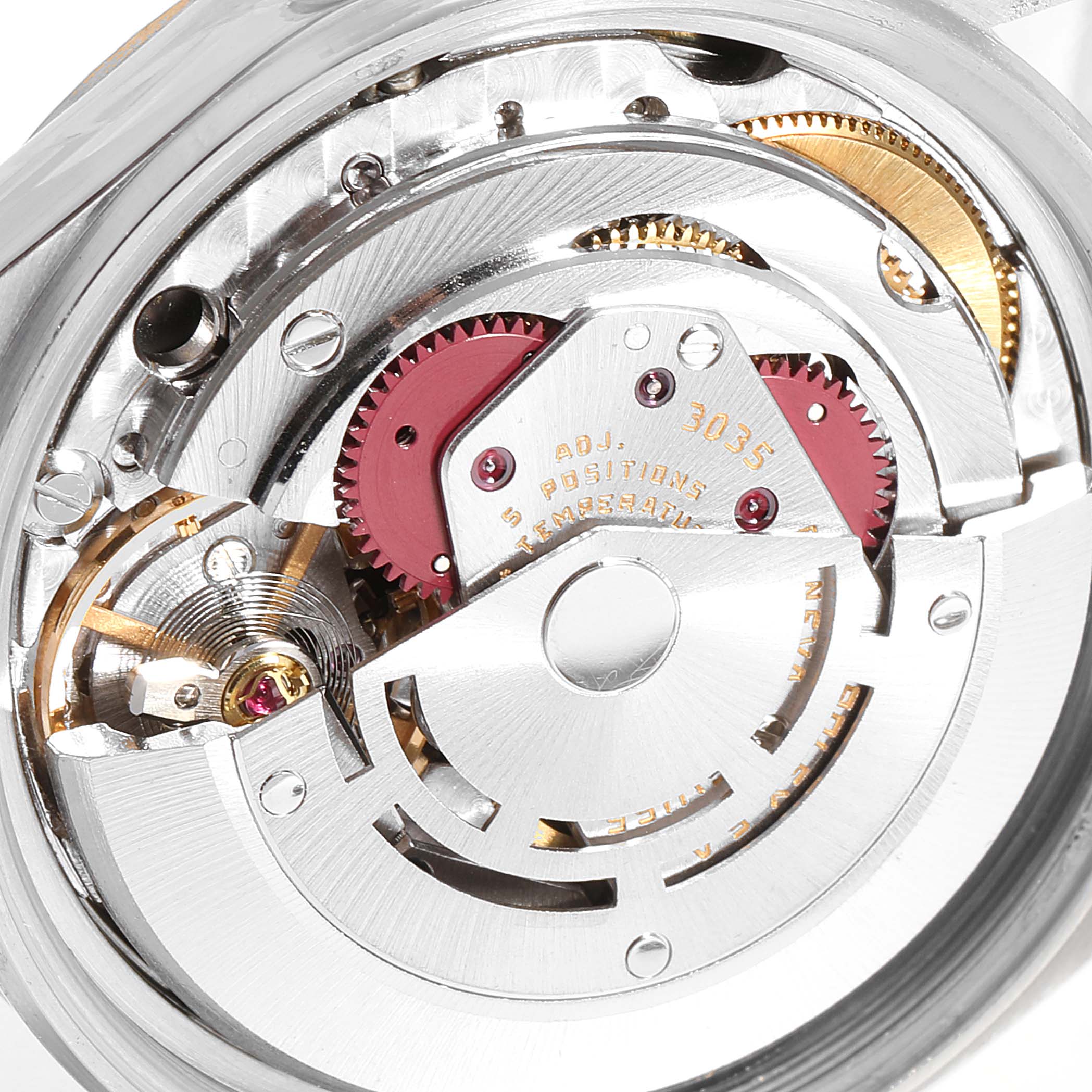 This is a close-up view of the internal mechanism of a Rolex Datejust 27465 Men
s Steel and Gold (two tone) Black Dial 27465 Men
s Steel and Gold (two tone) Black Dial watch, showing its intricate gears and components.