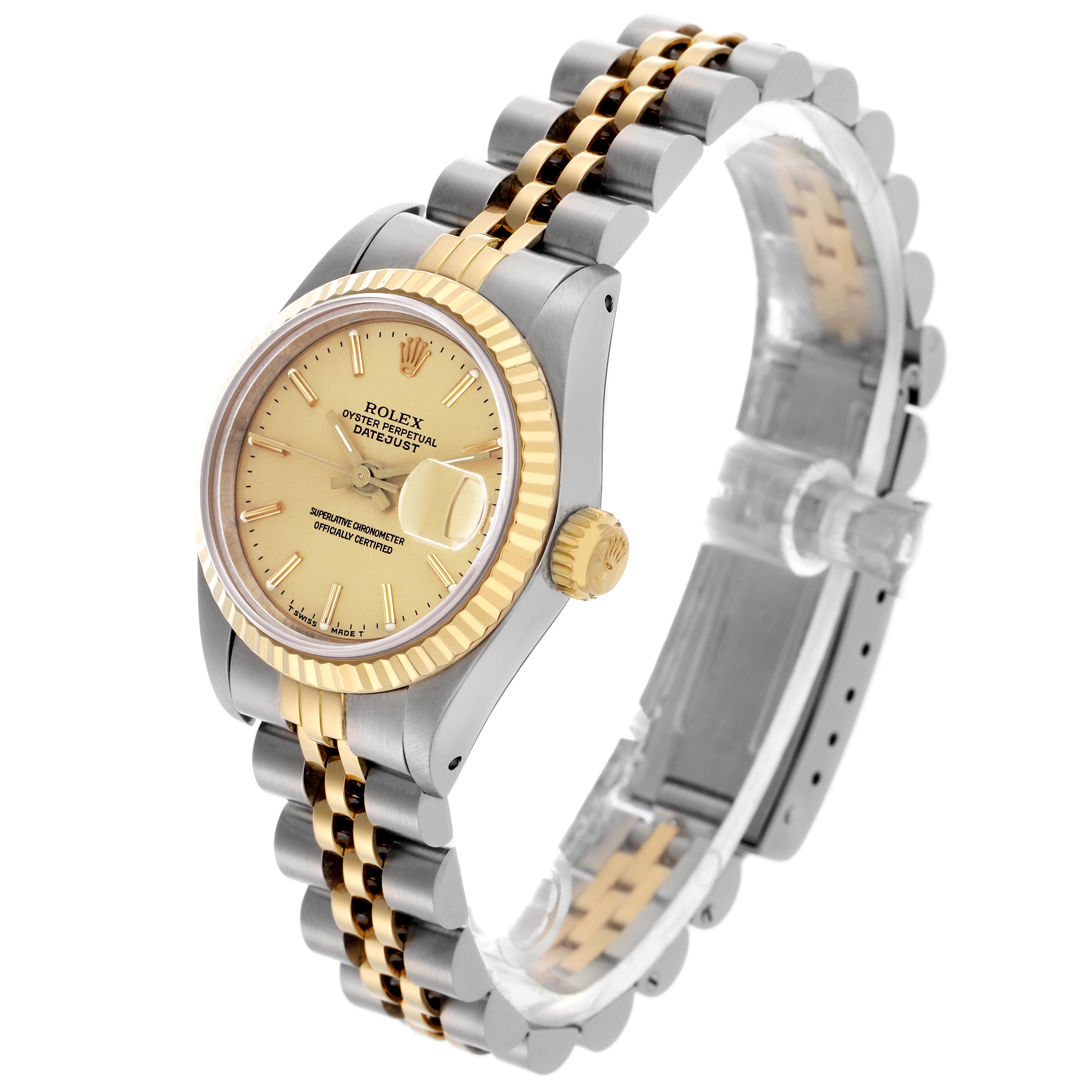 The Rolex Datejust 69173 Women
s Steel and Gold (two tone) Champagne Dial 69173 Women
s Steel and Gold (two tone) Champagne Dial watch is shown at a three-quarter angle, highlighting the case, bezel, dial, bracelet, and crown.