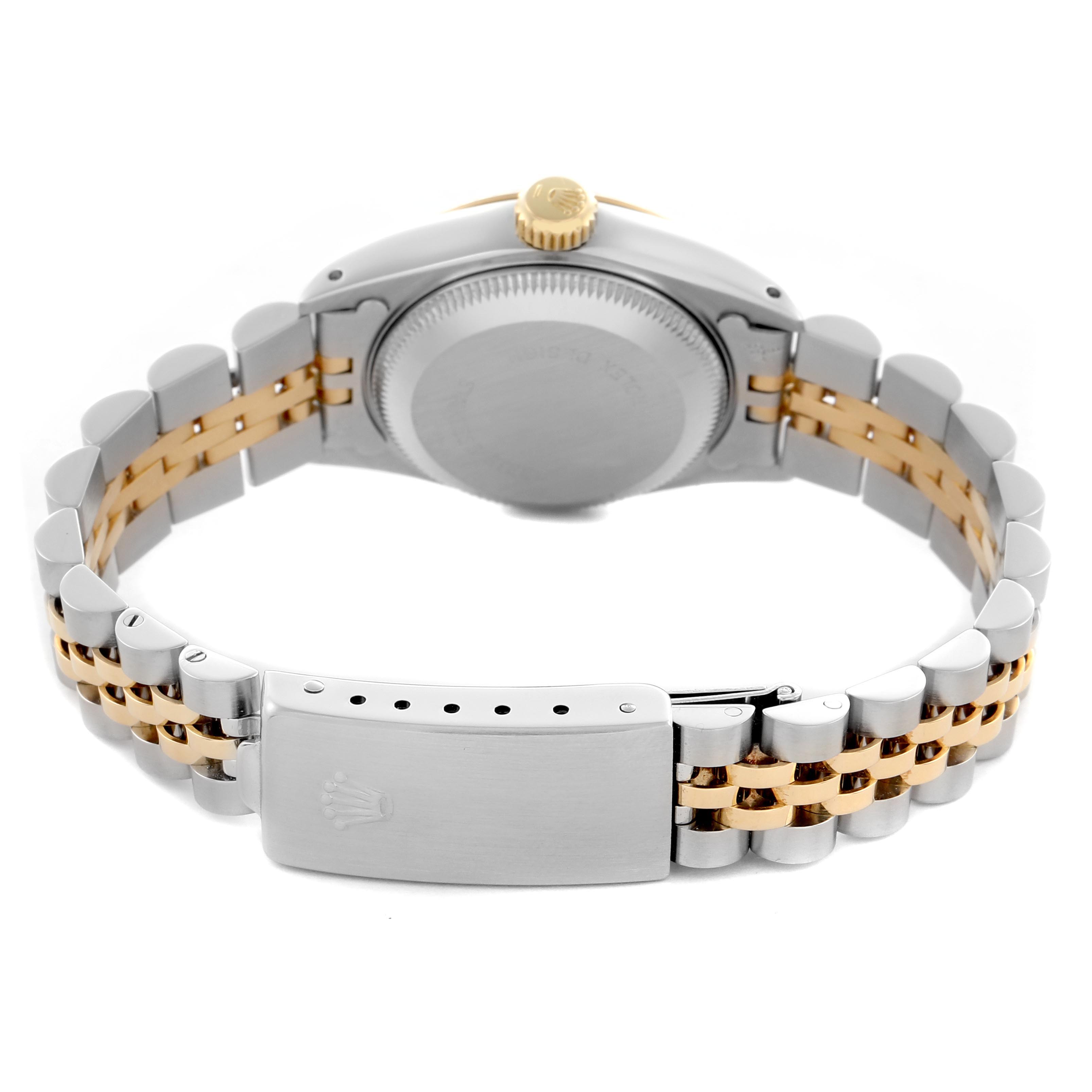 The image shows the back view of a Rolex Datejust 69173 Women
s Steel and Gold (two tone) Champagne Dial 69173 Women
s Steel and Gold (two tone) Champagne Dial, highlighting the case back, crown, and two-tone bracelet with clasp.