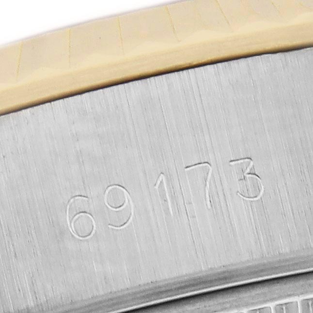 The image shows a close-up of the engraved model number on the case side of a Rolex Datejust 69173 Women
s Steel and Gold (two tone) Champagne Dial 69173 Women
s Steel and Gold (two tone) Champagne Dial watch.