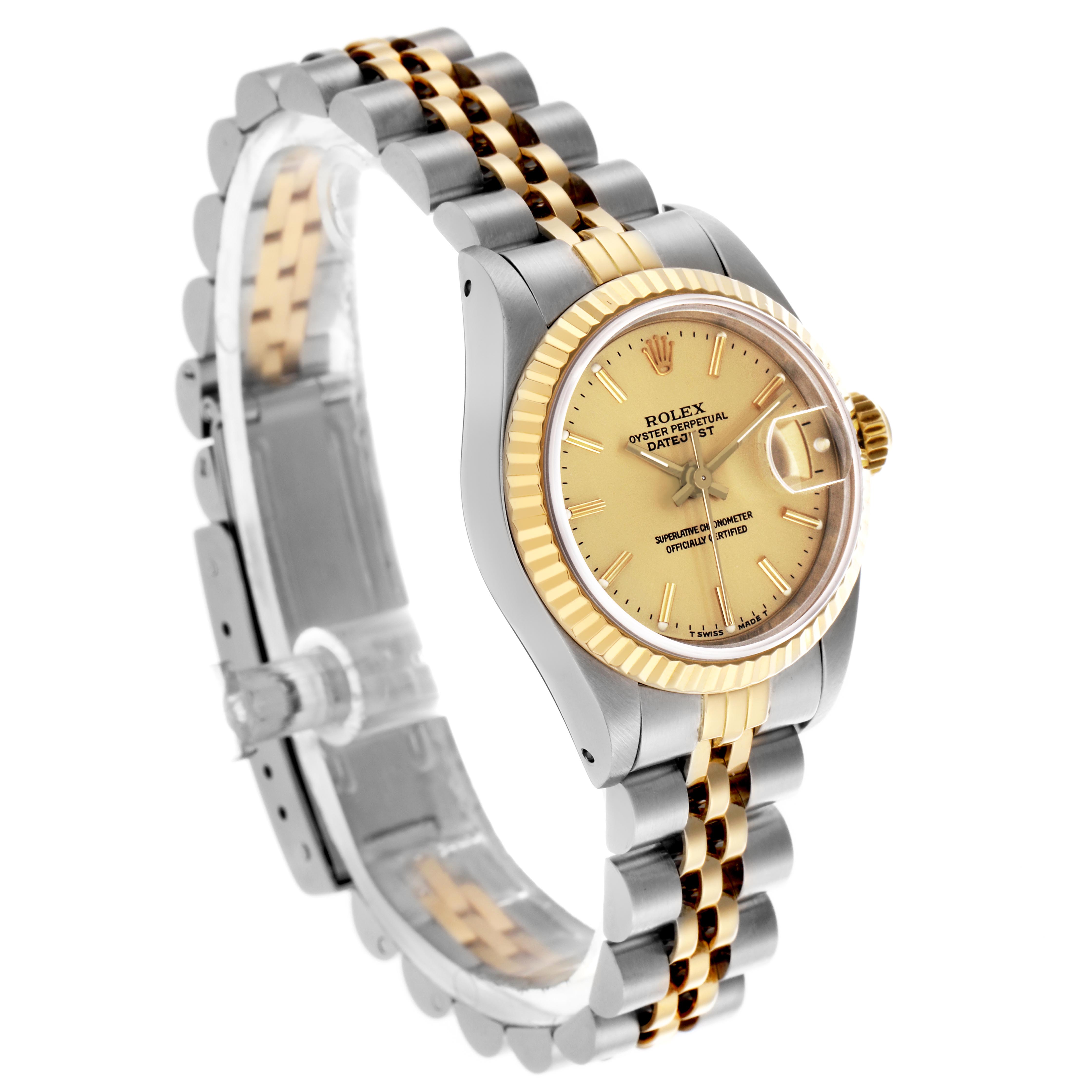 The Rolex Datejust 69173 Women
s Steel and Gold (two tone) Champagne Dial 69173 Women
s Steel and Gold (two tone) Champagne Dial watch is shown at an angled side view, revealing the dial, bezel, crown, and part of the bracelet.