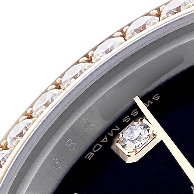 The image shows a close-up of the bezel and part of the dial of a Rolex Datejust 179383 Women
s Steel and Gold (two tone) Black Dial 179383 Women
s Steel and Gold (two tone) Black Dial, featuring diamond accents.