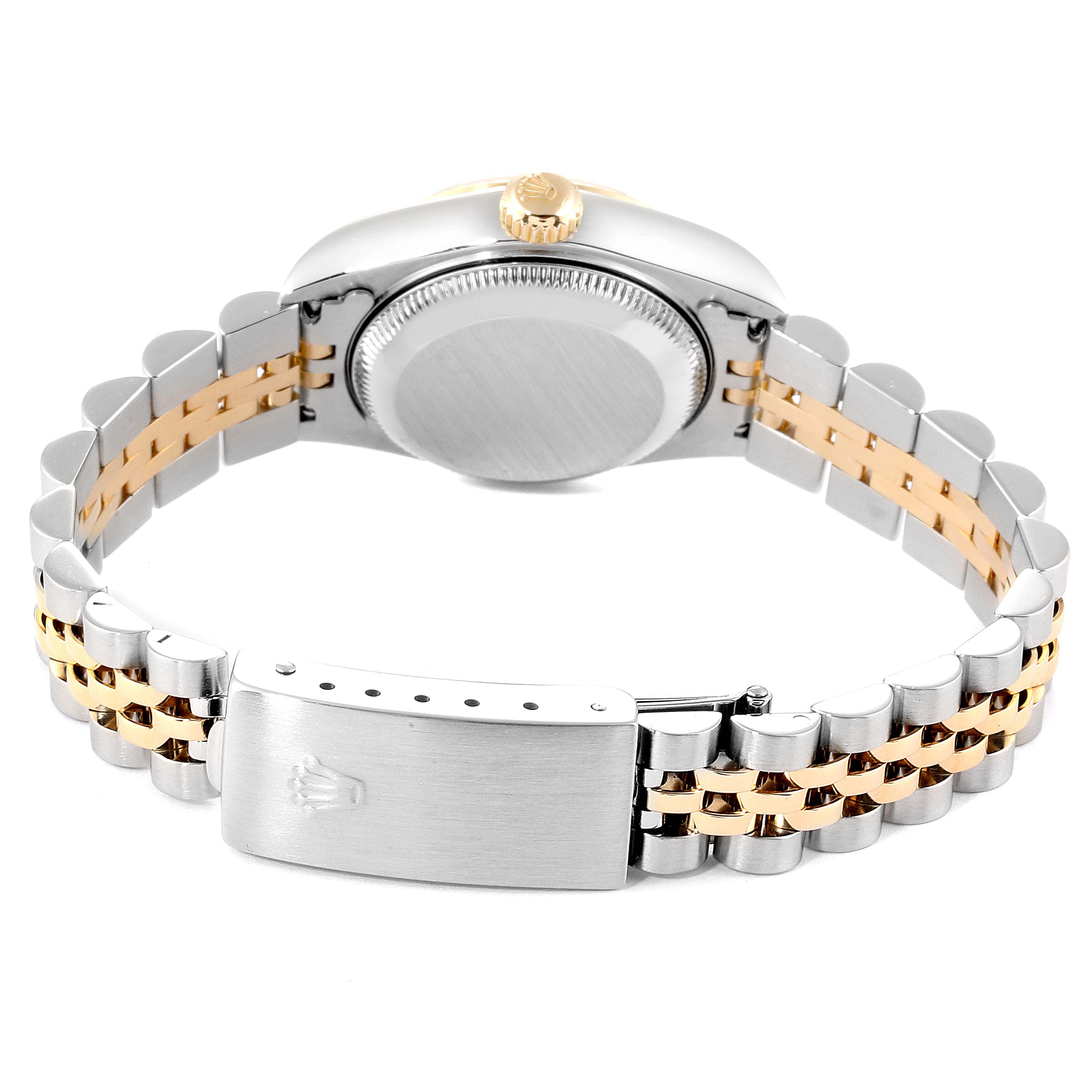 This image shows the back view of a Rolex Datejust 79173 Women
s Steel and Gold (two tone) Mother of Pearl Dial 79173 Women
s Steel and Gold (two tone) Mother of Pearl Dial watch, highlighting its caseback, crown, and two-tone bracelet with clasp.