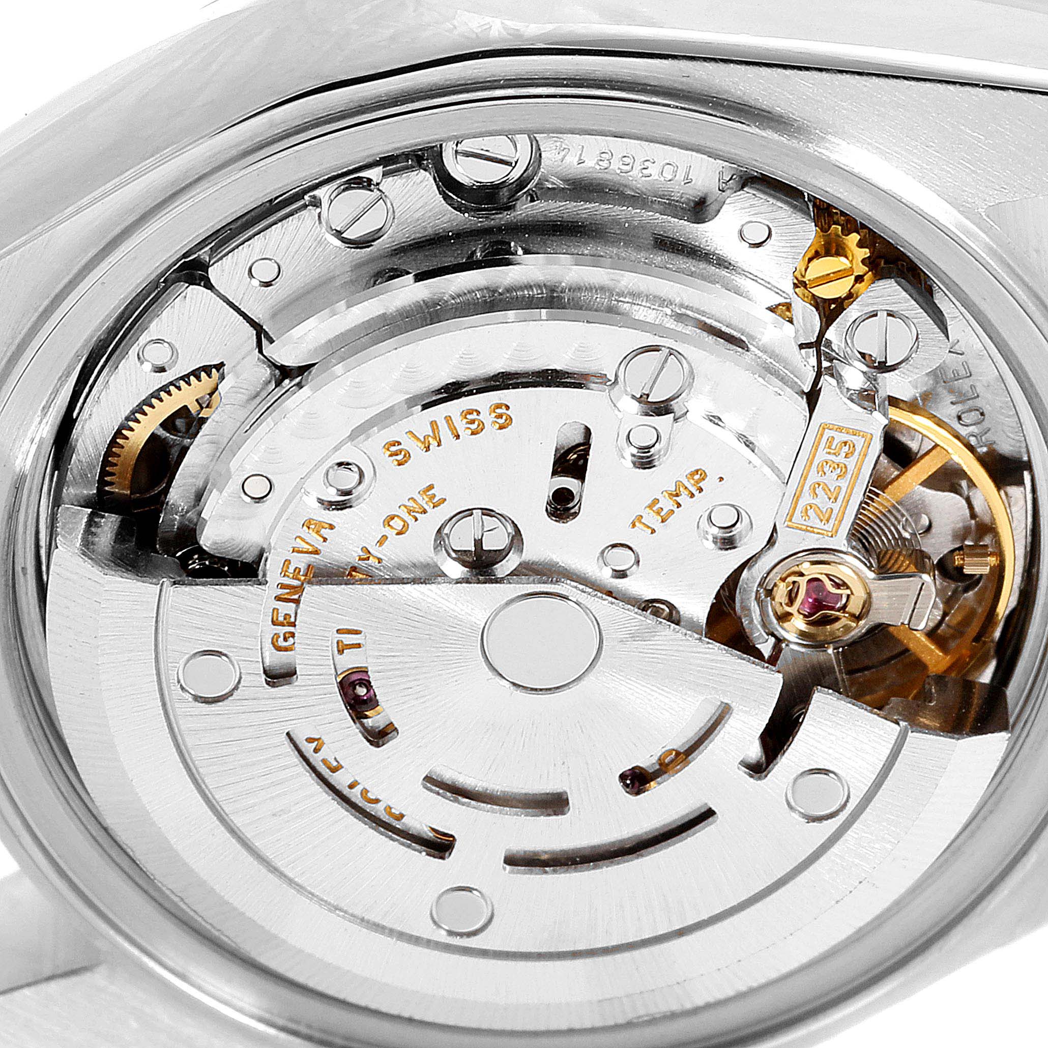 The image displays the intricate inner mechanism and movement of a Rolex Datejust 79173 Women
s Steel and Gold (two tone) Mother of Pearl Dial 79173 Women
s Steel and Gold (two tone) Mother of Pearl Dial watch from a close-up angle.