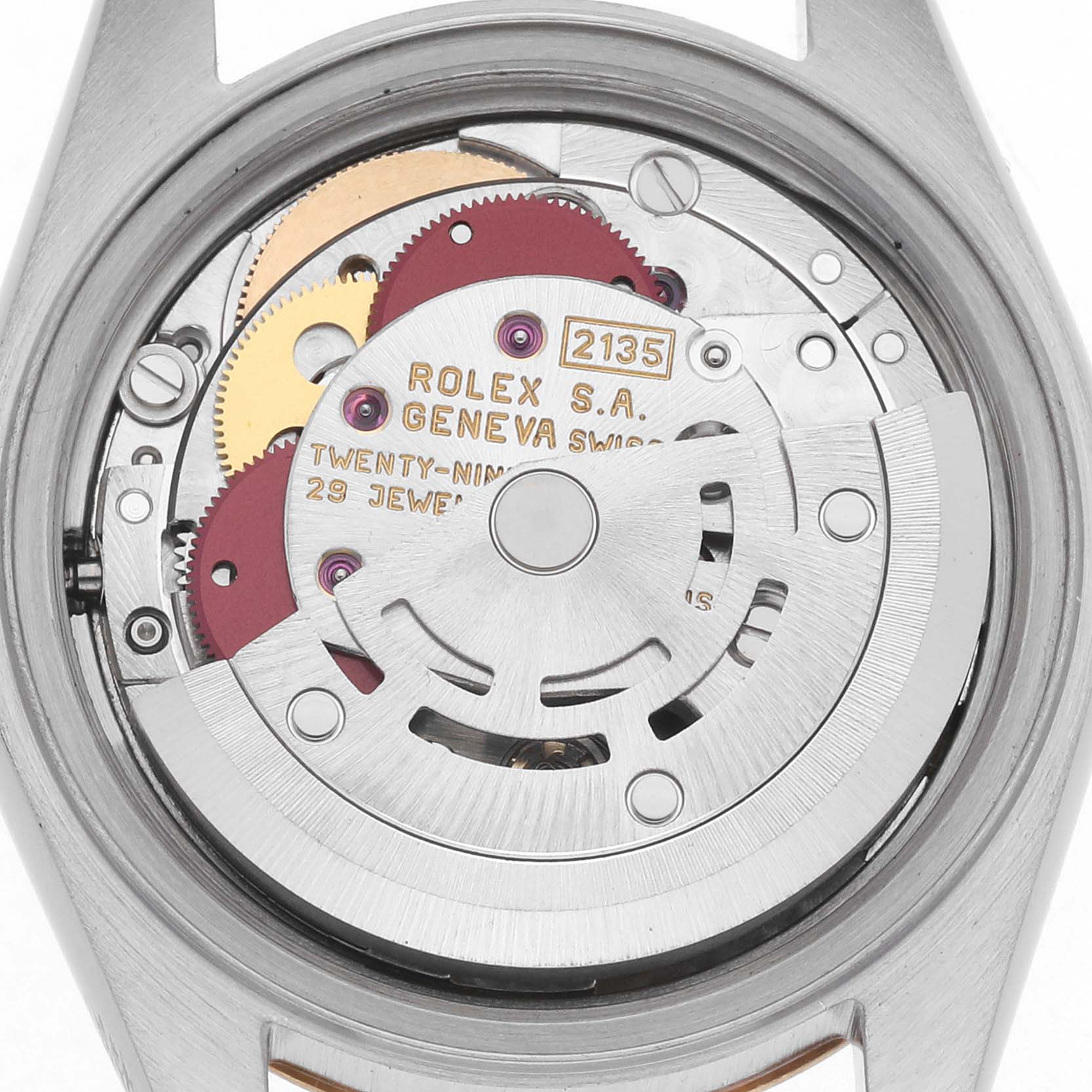 The image shows the inner movement of a Rolex Datejust 69163 Women
s Steel and Gold (two tone) Grey Dial 69163 Women
s Steel and Gold (two tone) Grey Dial, highlighting gears and the rotor from a back view.