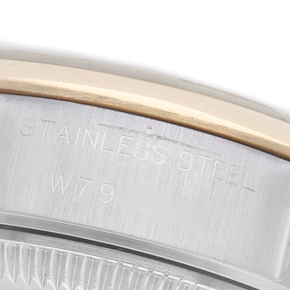 The image shows a close-up angle of the Rolex Datejust 69163 Women
s Steel and Gold (two tone) Grey Dial 69163 Women
s Steel and Gold (two tone) Grey Dial
s case, highlighting the stainless steel engraving.