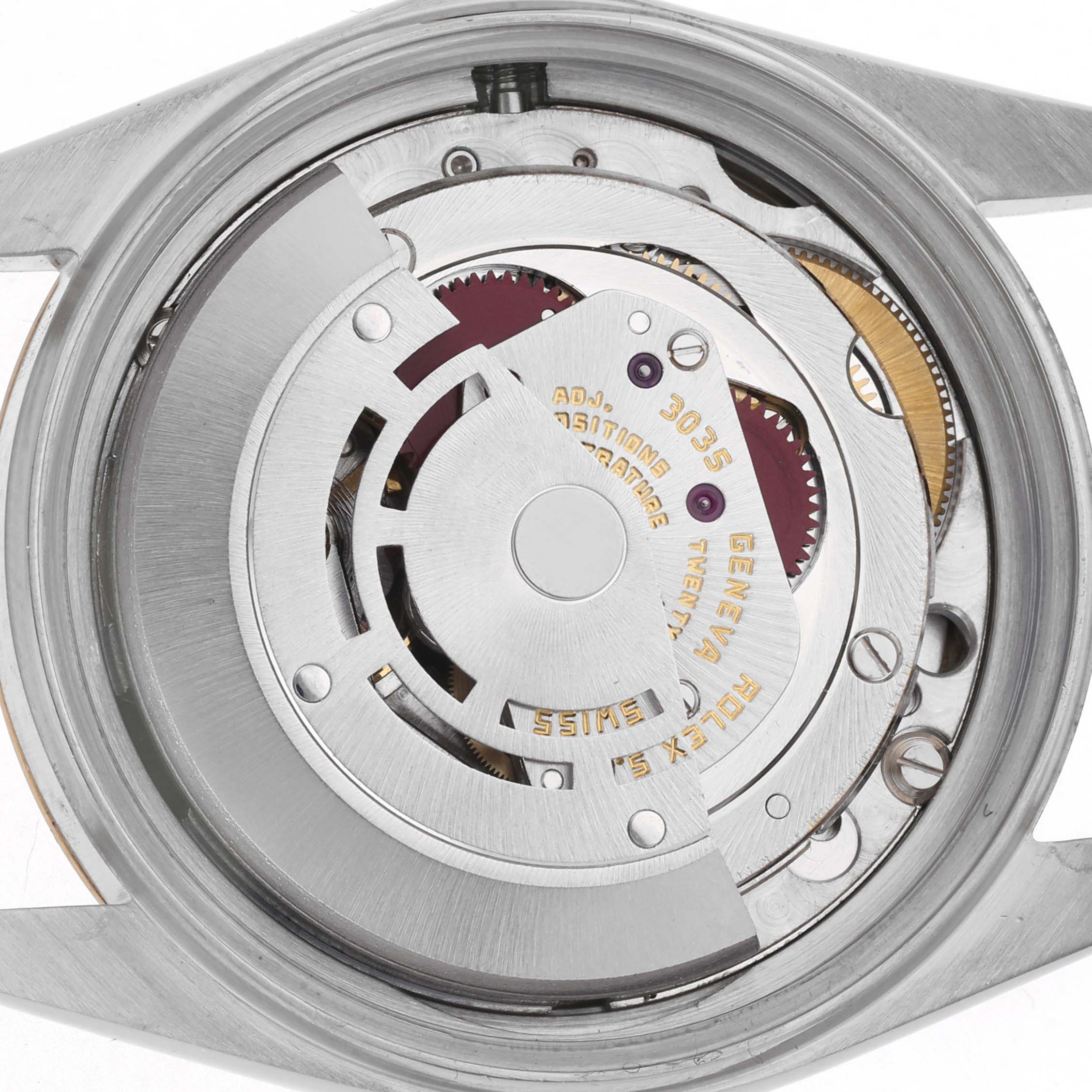 The image shows the movement of a Rolex Datejust 16013 Men's Steel and Gold (two tone) Champagne Dial 16013 Men's Steel and Gold (two tone) Champagne Dial from a back angle, highlighting the rotor and gears.