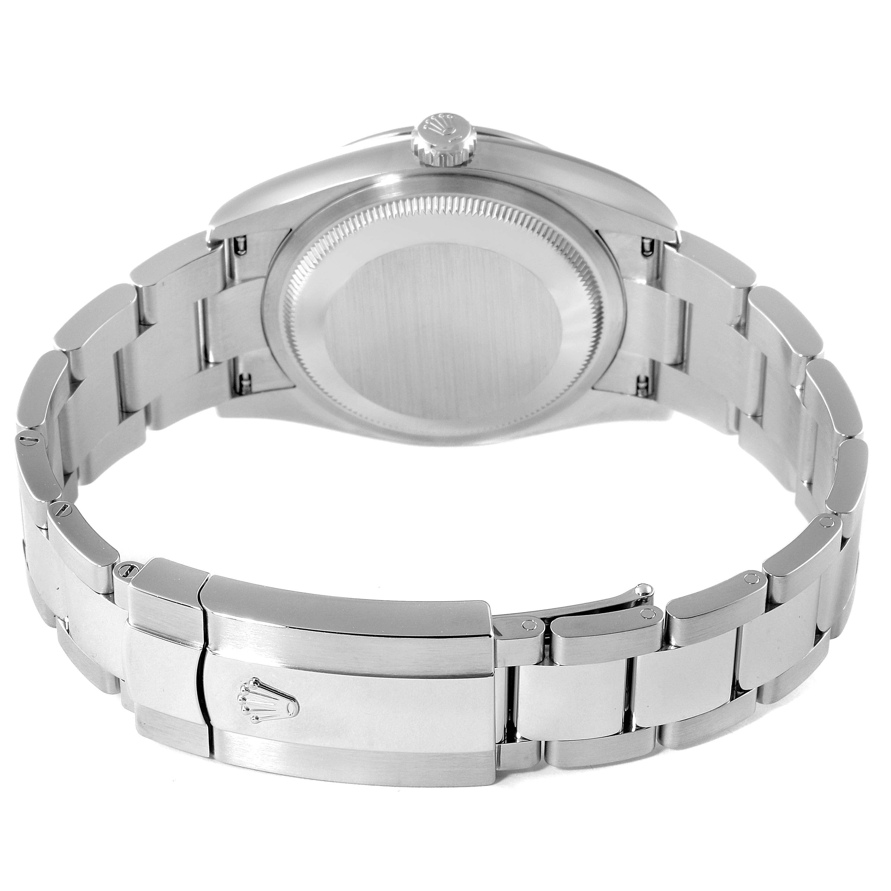 This is an image of a Rolex Datejust 126200 Men
s Stainless Steel White Dial 126200 Men
s Stainless Steel White Dial watch viewed from the back, showcasing the case back, bracelet, and clasp.