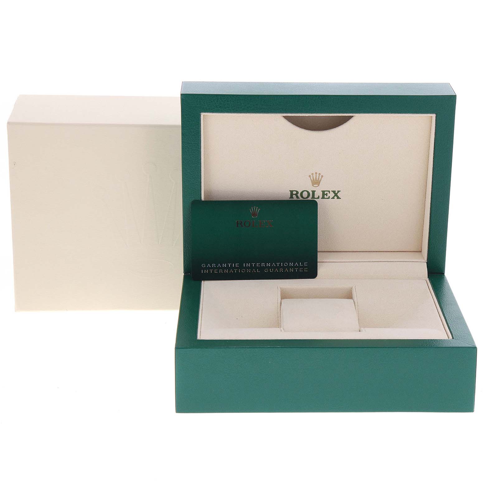 The image shows an open Rolex Datejust 126200 Men
s Stainless Steel White Dial 126200 Men
s Stainless Steel White Dial box with the international guarantee card placed inside.