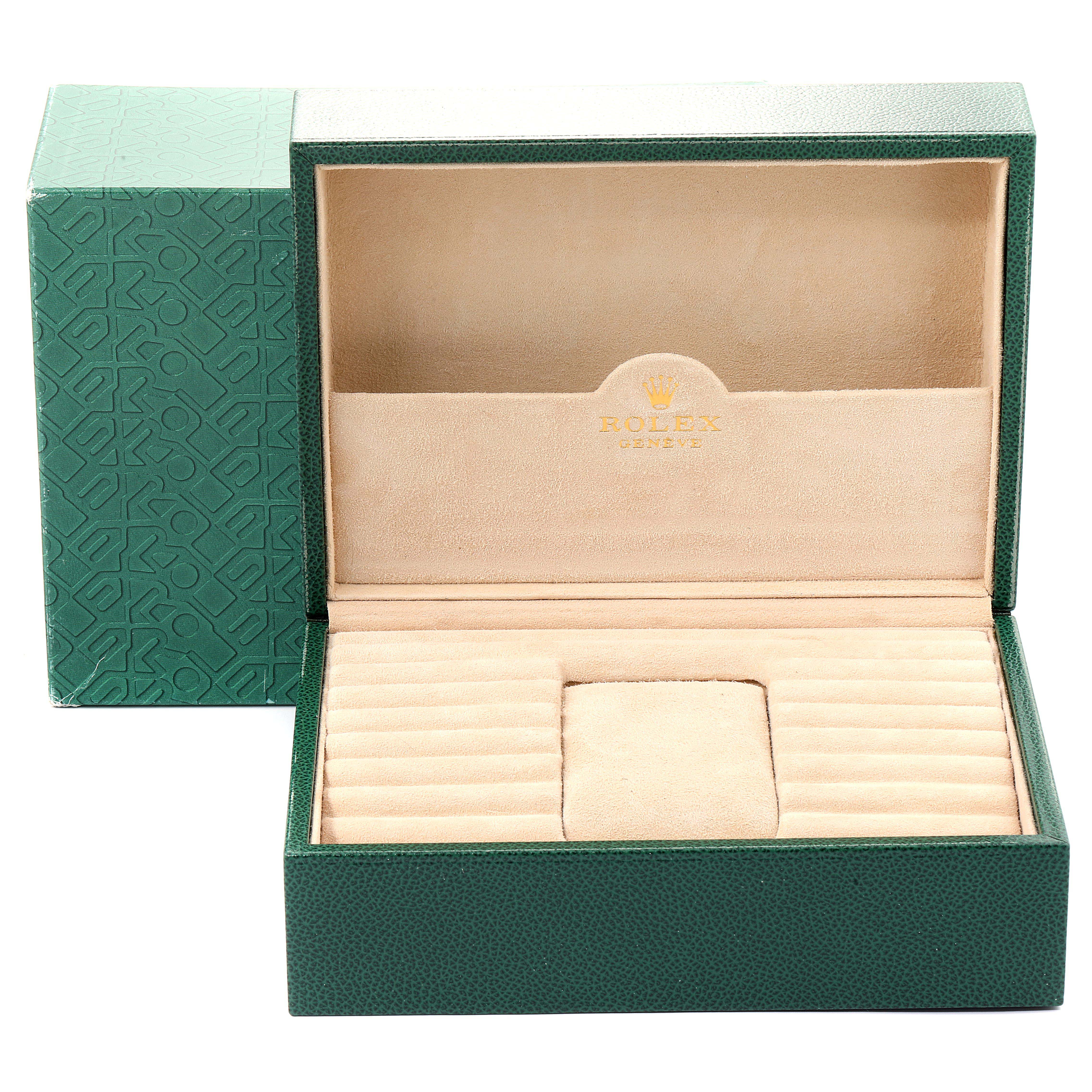 This image shows an open green and beige Rolex watch box for the President model, emphasizing the interior compartments.