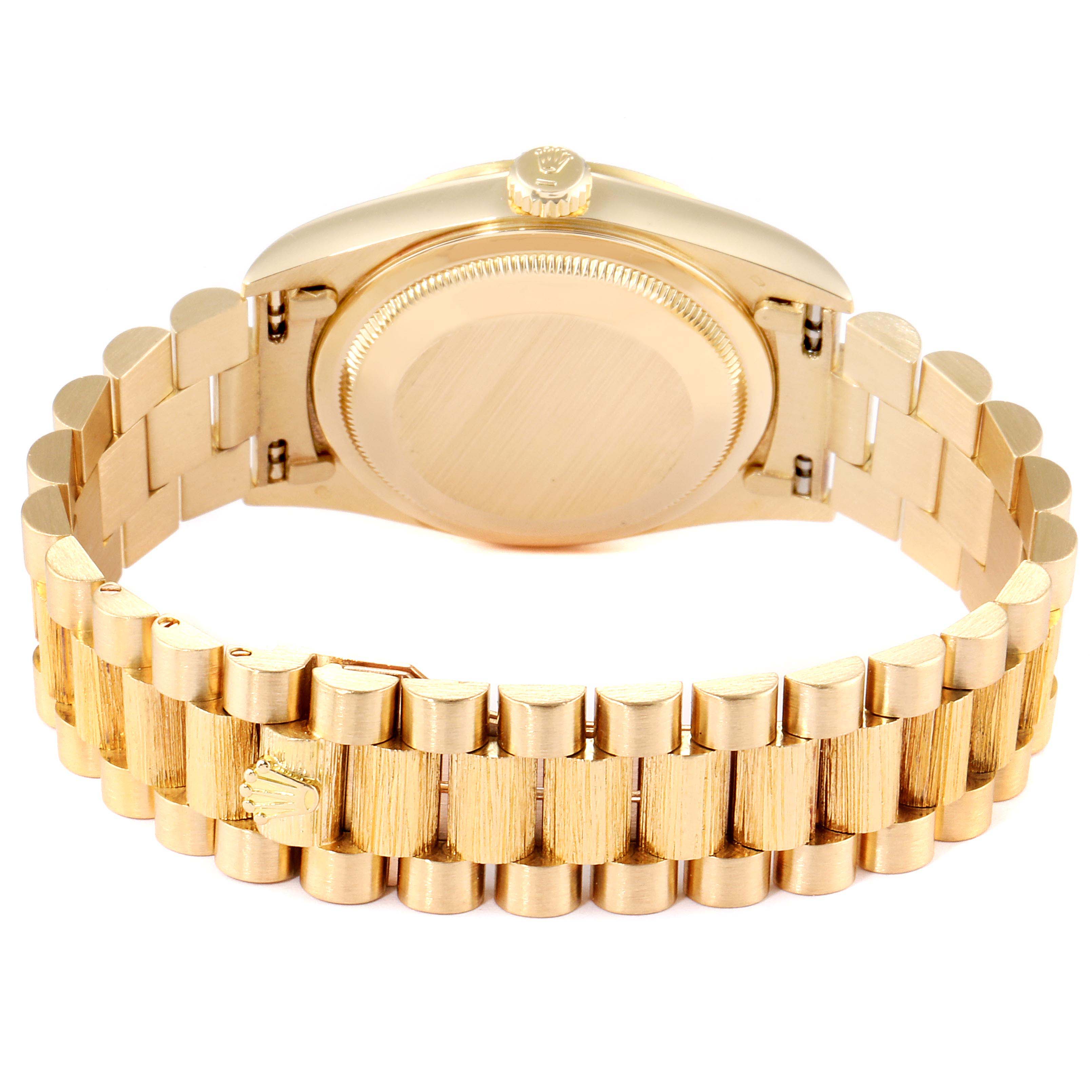 This image shows the back of a Rolex President 18248 Men
s Yellow Gold Champagne Dial 18248 Men
s Yellow Gold Champagne Dial model watch, focusing on the case back and the bracelet.