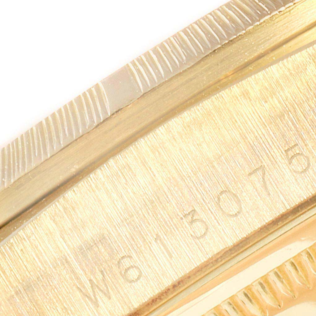 This close-up image shows the serial number engraving on the side of the case of a Rolex President 18248 Men
s Yellow Gold Champagne Dial 18248 Men
s Yellow Gold Champagne Dial watch.