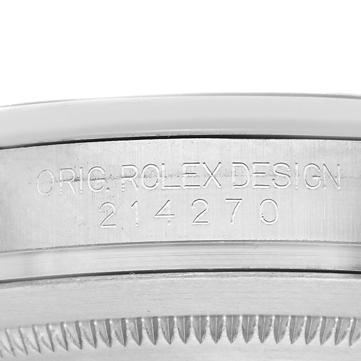 The image shows the side engraving on a Rolex Explorer 214270 Men
s Stainless Steel Black Dial 214270 Men
s Stainless Steel Black Dial, model number 214270, displaying "ORIG. ROLEX DESIGN."