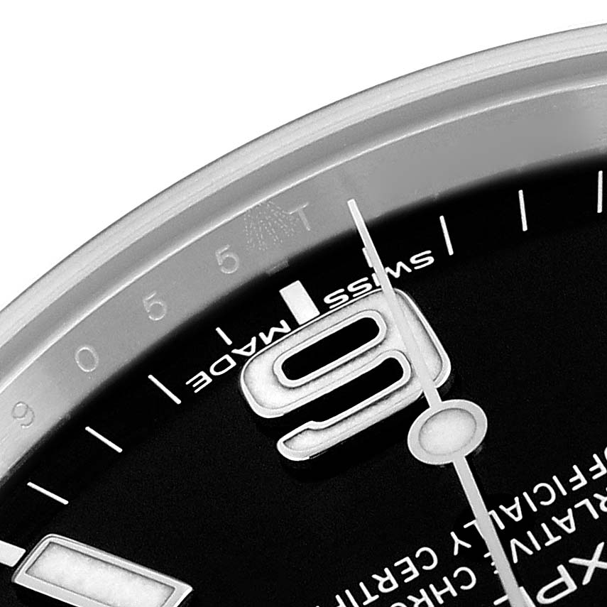 The image shows a close-up of a Rolex Explorer 214270 Men
s Stainless Steel Black Dial 214270 Men
s Stainless Steel Black Dial watch face, highlighting the number "9," hour markers, and "SWISS MADE" text.