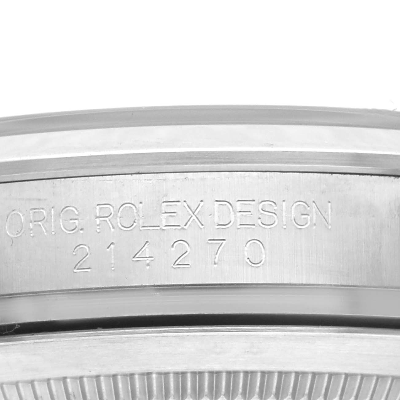 The image shows the side engraving on the case of a Rolex Explorer 214270 Men
s Stainless Steel Black Dial 214270 Men
s Stainless Steel Black Dial, displaying "ORIG. ROLEX DESIGN" and model number 214270.