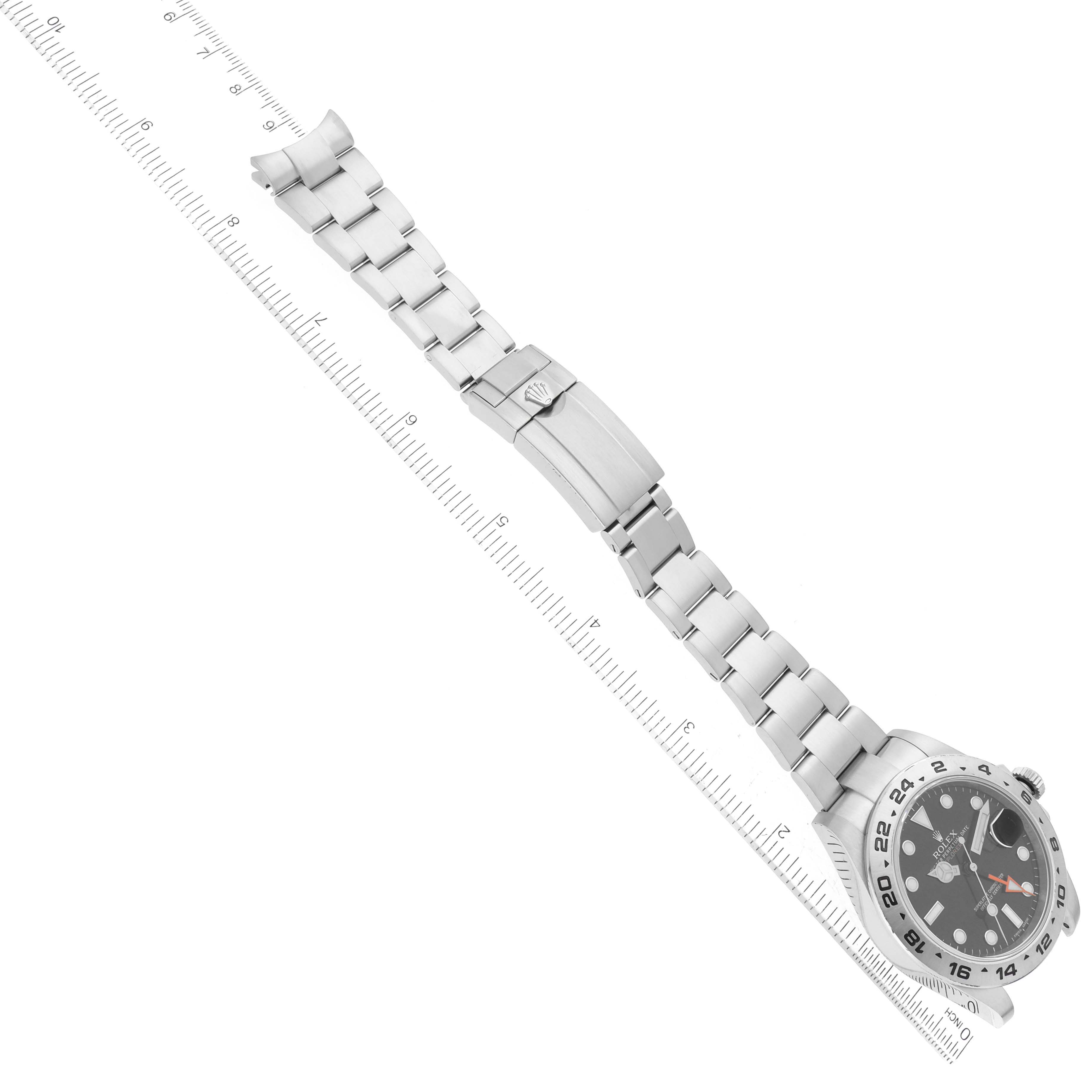 The image shows a top-down view of a Rolex Explorer 216570 Men
s Stainless Steel Black Dial 216570 Men
s Stainless Steel Black Dial watch, displaying its face, bracelet, and clasp.