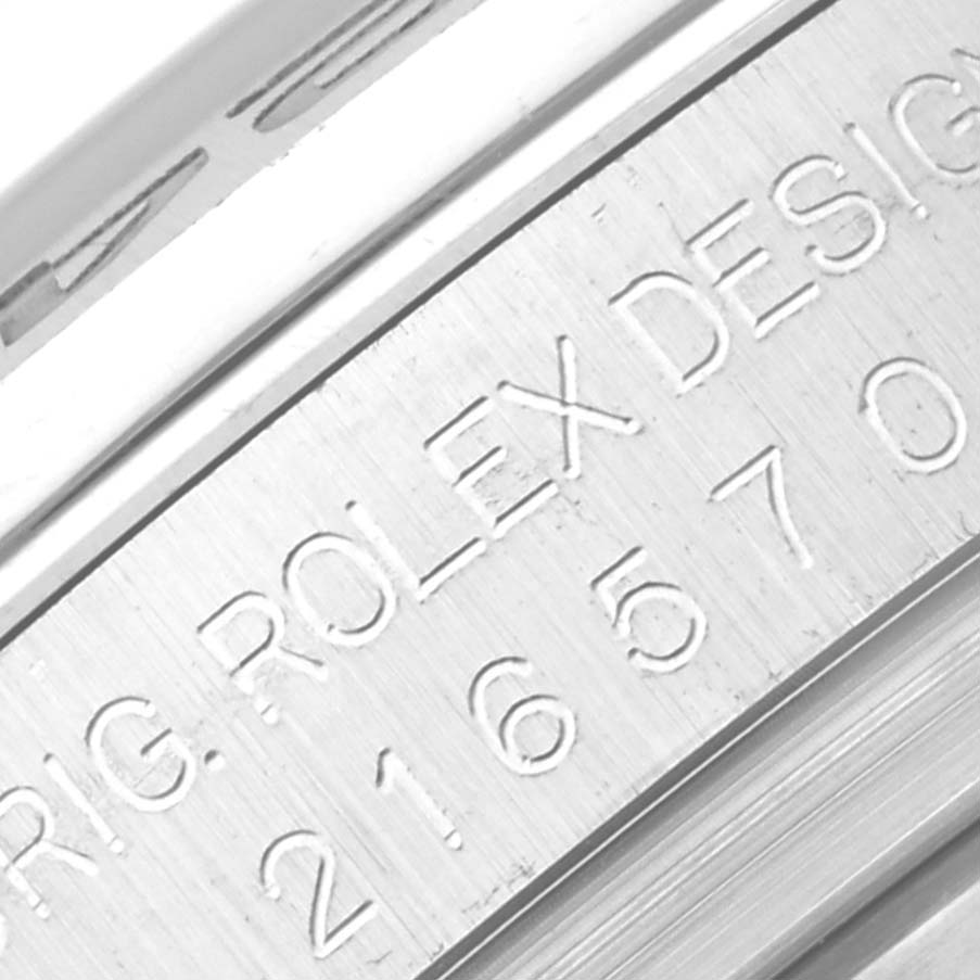 This image shows a close-up of the engraved serial number and branding on the flange of a Rolex Explorer 216570 Men
s Stainless Steel Black Dial 216570 Men
s Stainless Steel Black Dial model watch.