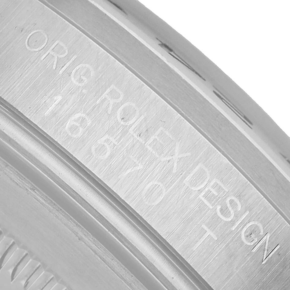 The image shows the side engraving on a Rolex Explorer 16570 Men's Stainless Steel White Dial, focusing on model number and design details.