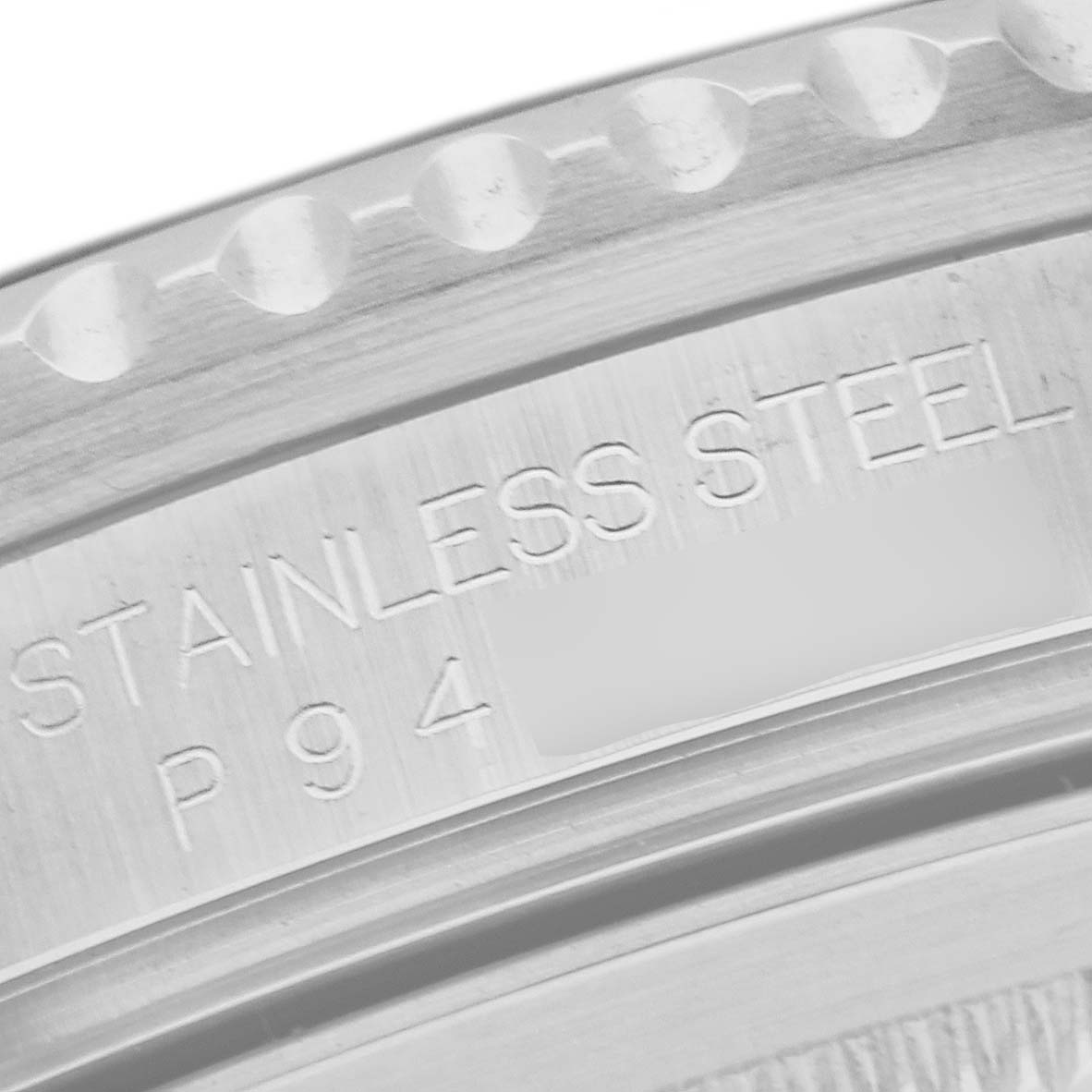 This is a close-up angle of a Rolex GMT-Master 16710 Men
s Stainless Steel Black Dial 16710 Men
s Stainless Steel Black Dial watch, showing the engraved "STAINLESS STEEL" text on the case.