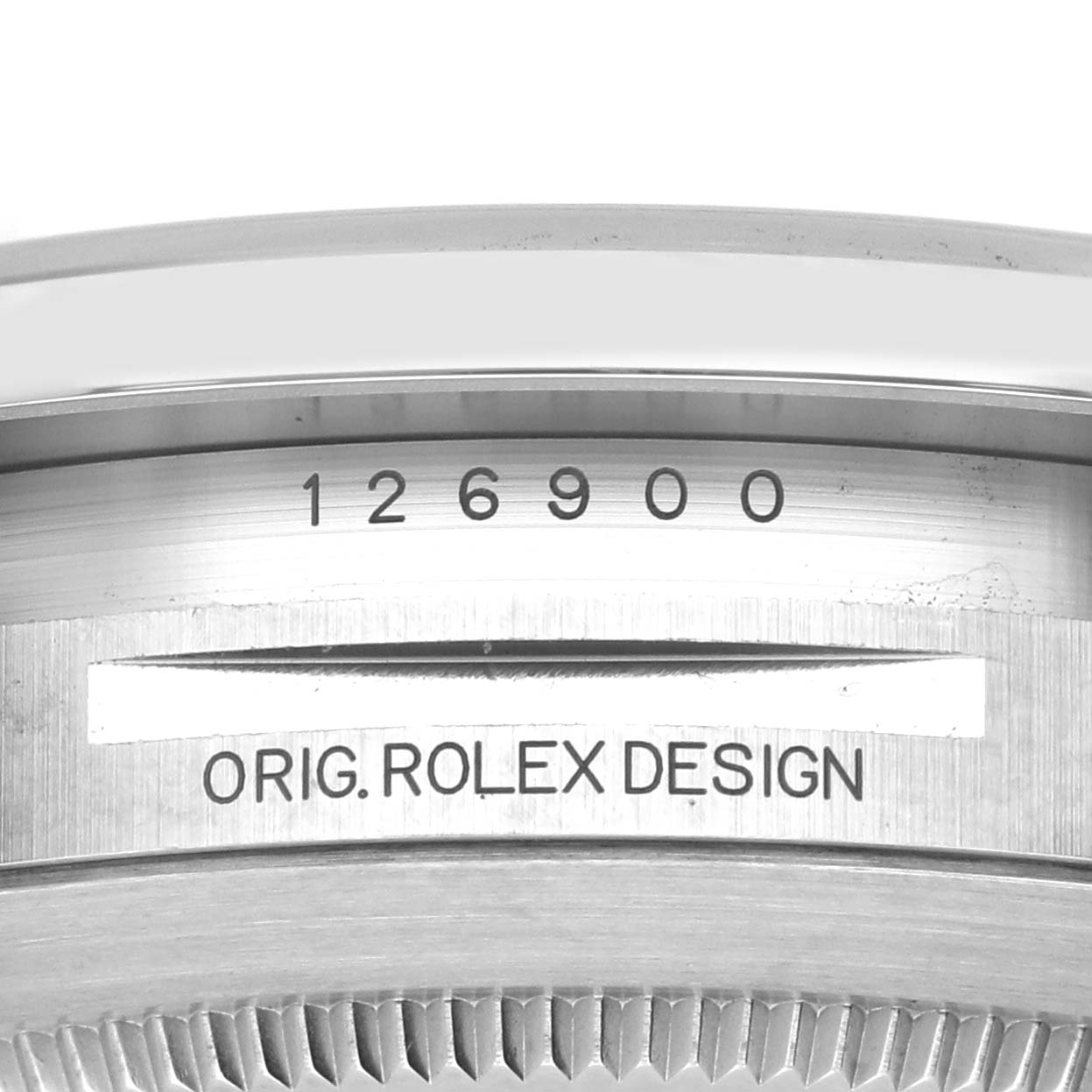 The image shows a close-up of the case back of the Rolex Air-King 126900 Men's Stainless Steel Black Dial, featuring the model number and "ORIG. ROLEX DESIGN" engraving.