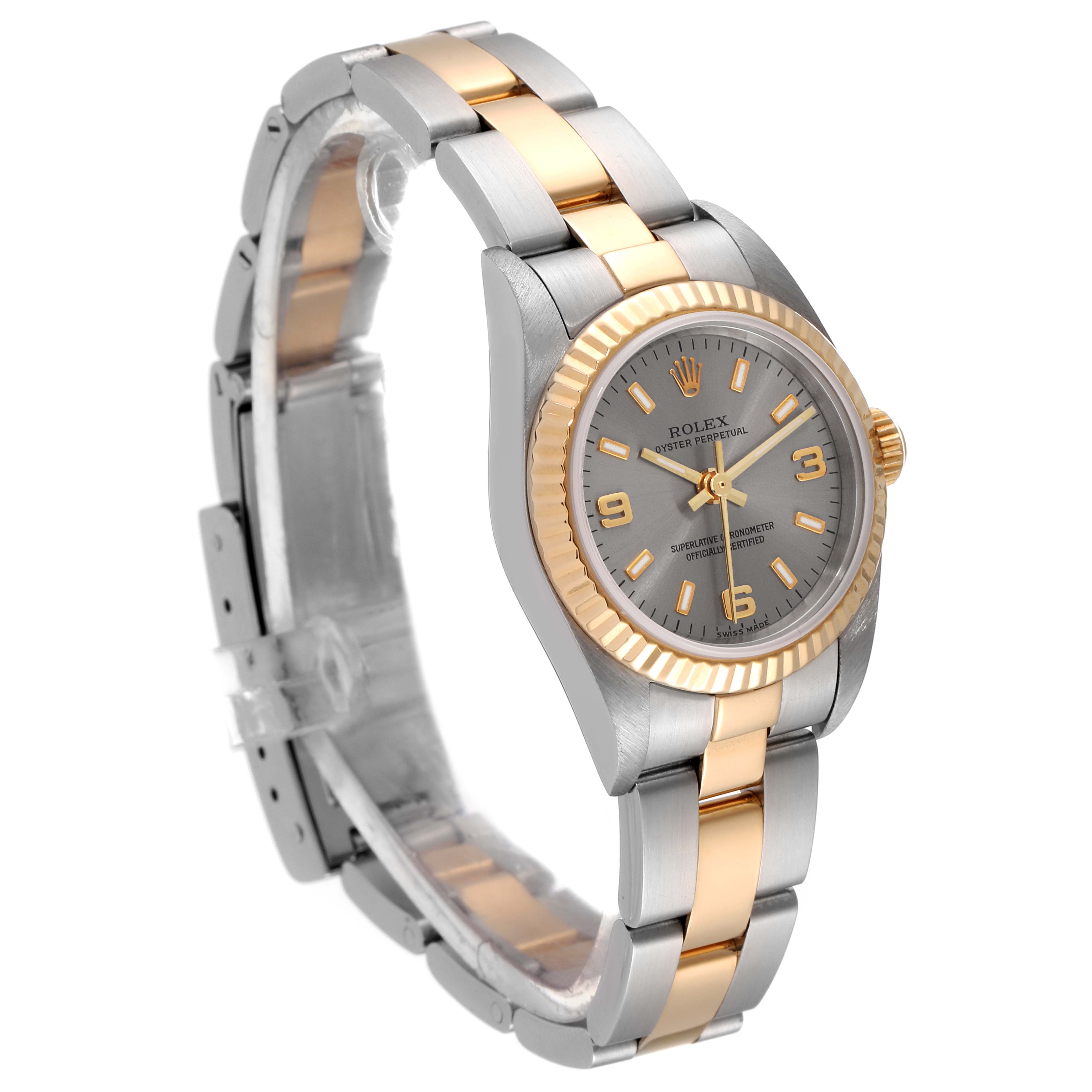 The image shows a Rolex Oyster Perpetual 76193 Women's Steel and Gold (two tone) Grey Dial 76193 Women's Steel and Gold (two tone) Grey Dial watch at a three-quarter angle, highlighting the bracelet, bezel, and face.